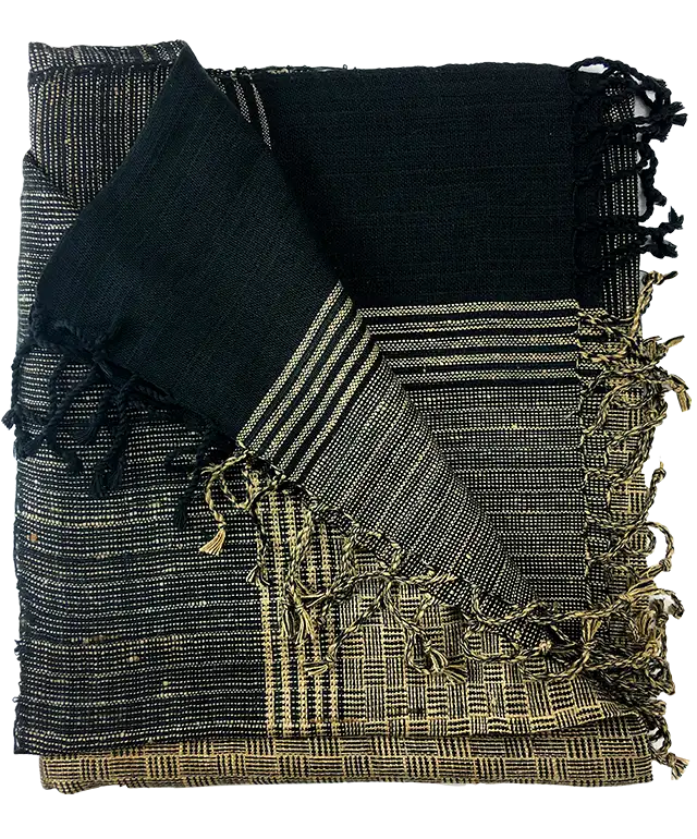 Eri ‘Assam’ silk stole on a hanger with black outfit, plain wall in background