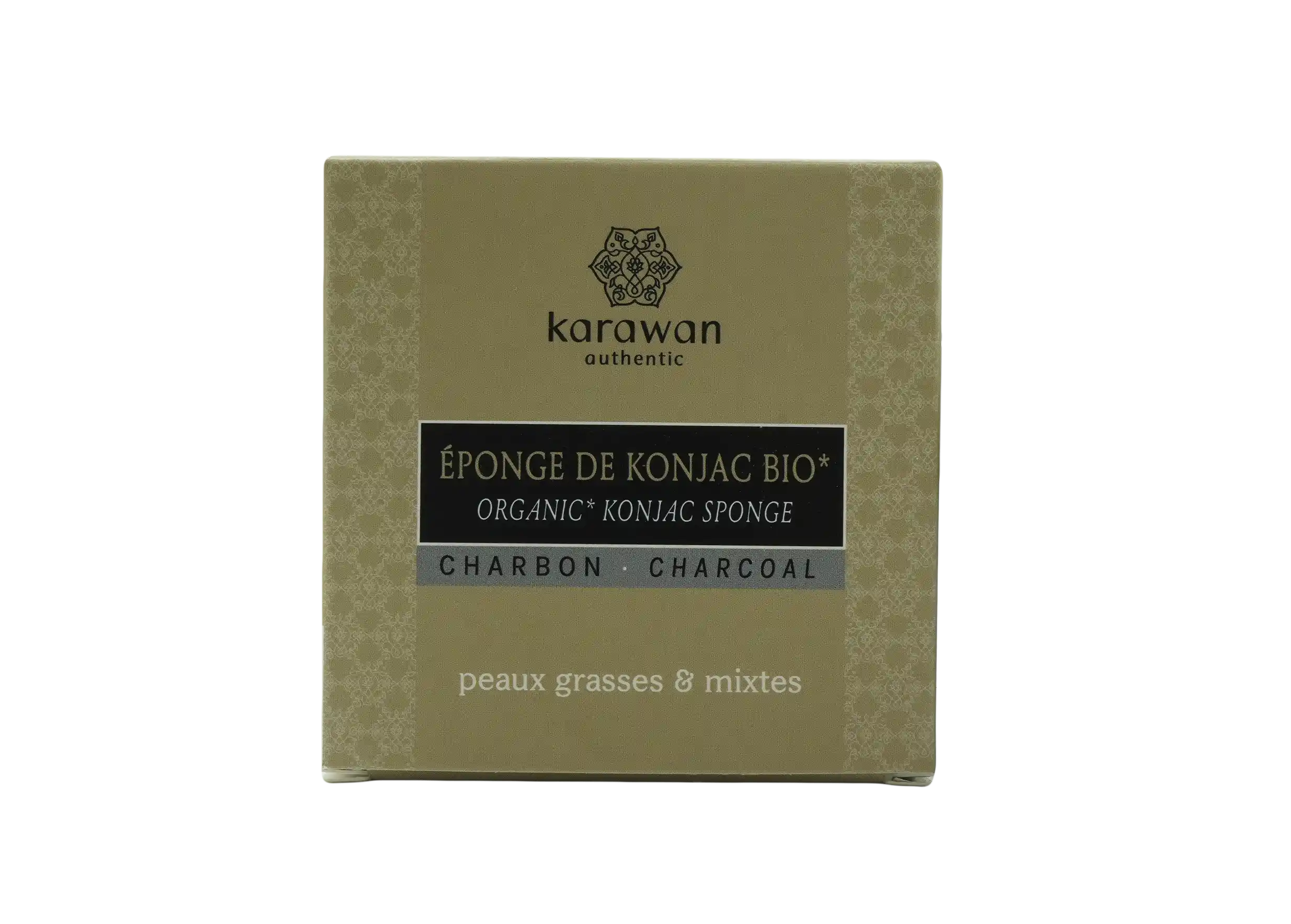 Éponge konjac bio au charbon de bambou, posée contre son packaging en carton, une création Karawan