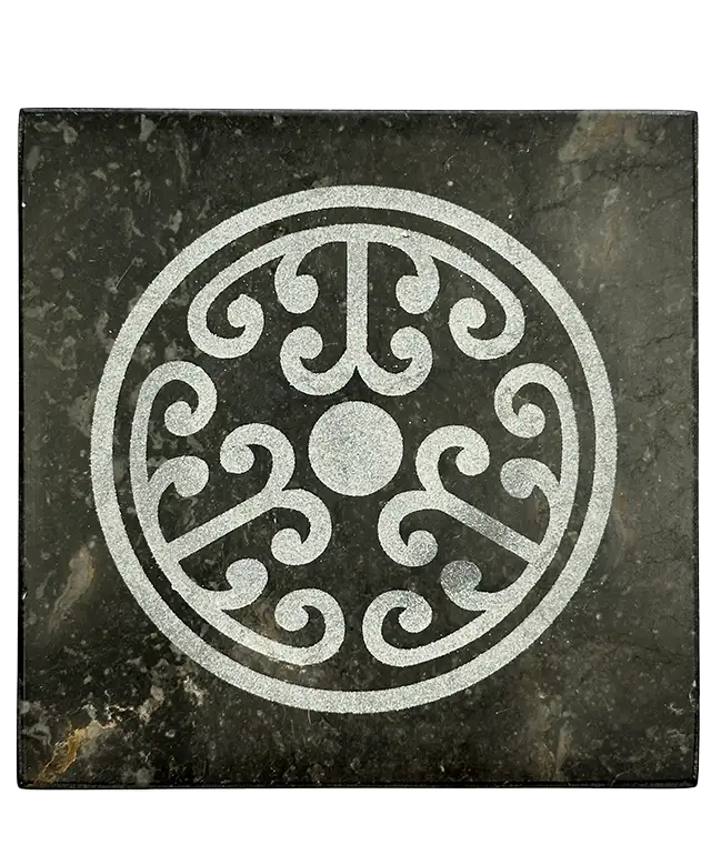 Black marble soap dish on an organic cotton fouta towel, accompanied by Aleppo soap