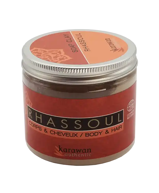 Rhassoul powder in a 200g jar, and black kessa glove with beige edging