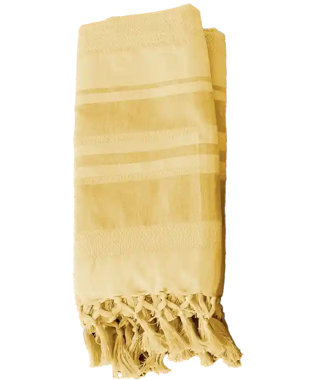 3 Garden organic cotton foutas hung on a wall, in purple, yellow and blue