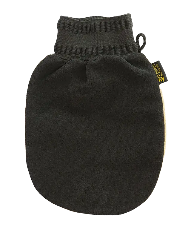 Handmade pot of pure olive authentic black soap on a black kessa scrubbing glove