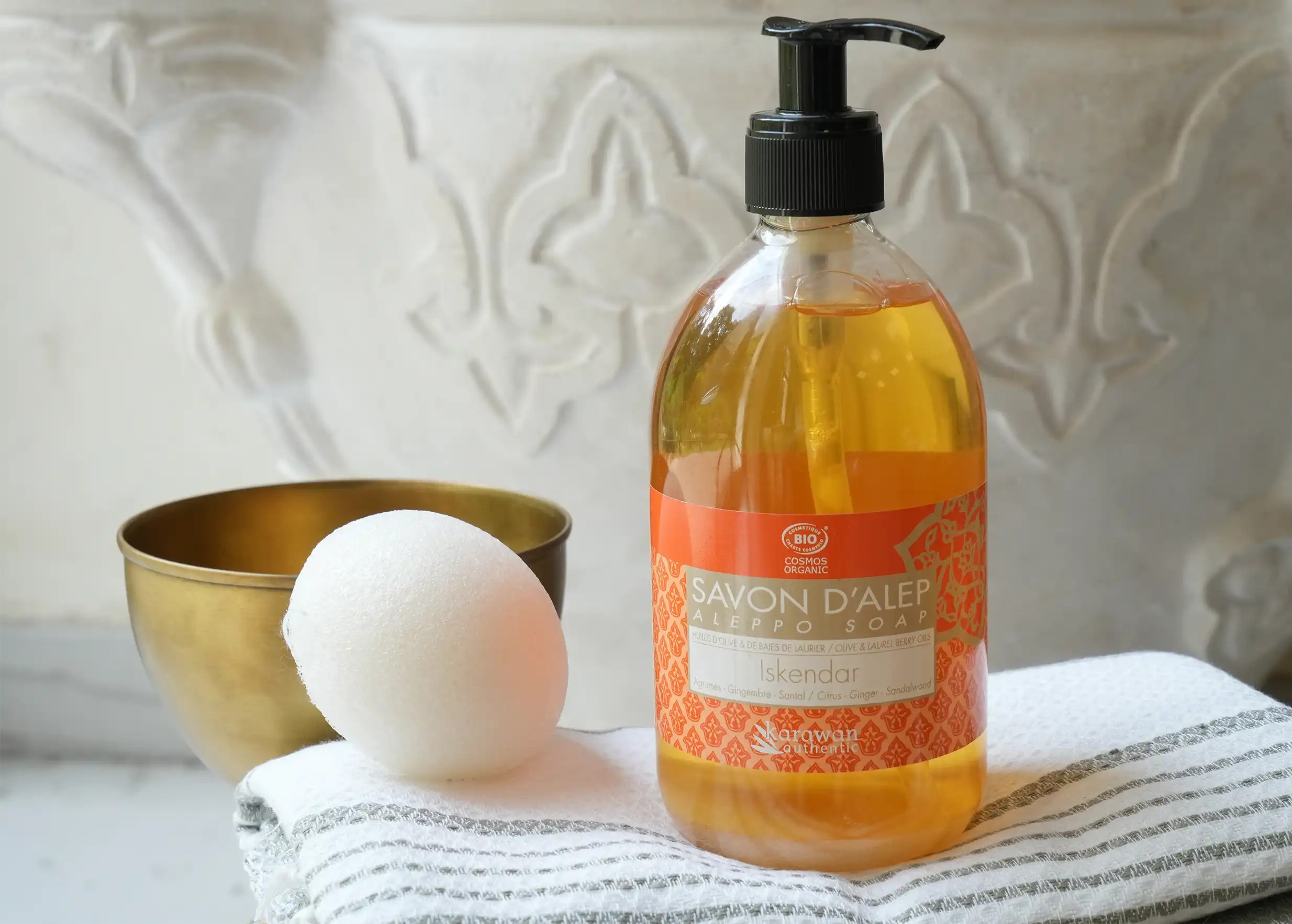 Organic liquid Aleppo soap in a pump bottle and vegetable konjac sponge