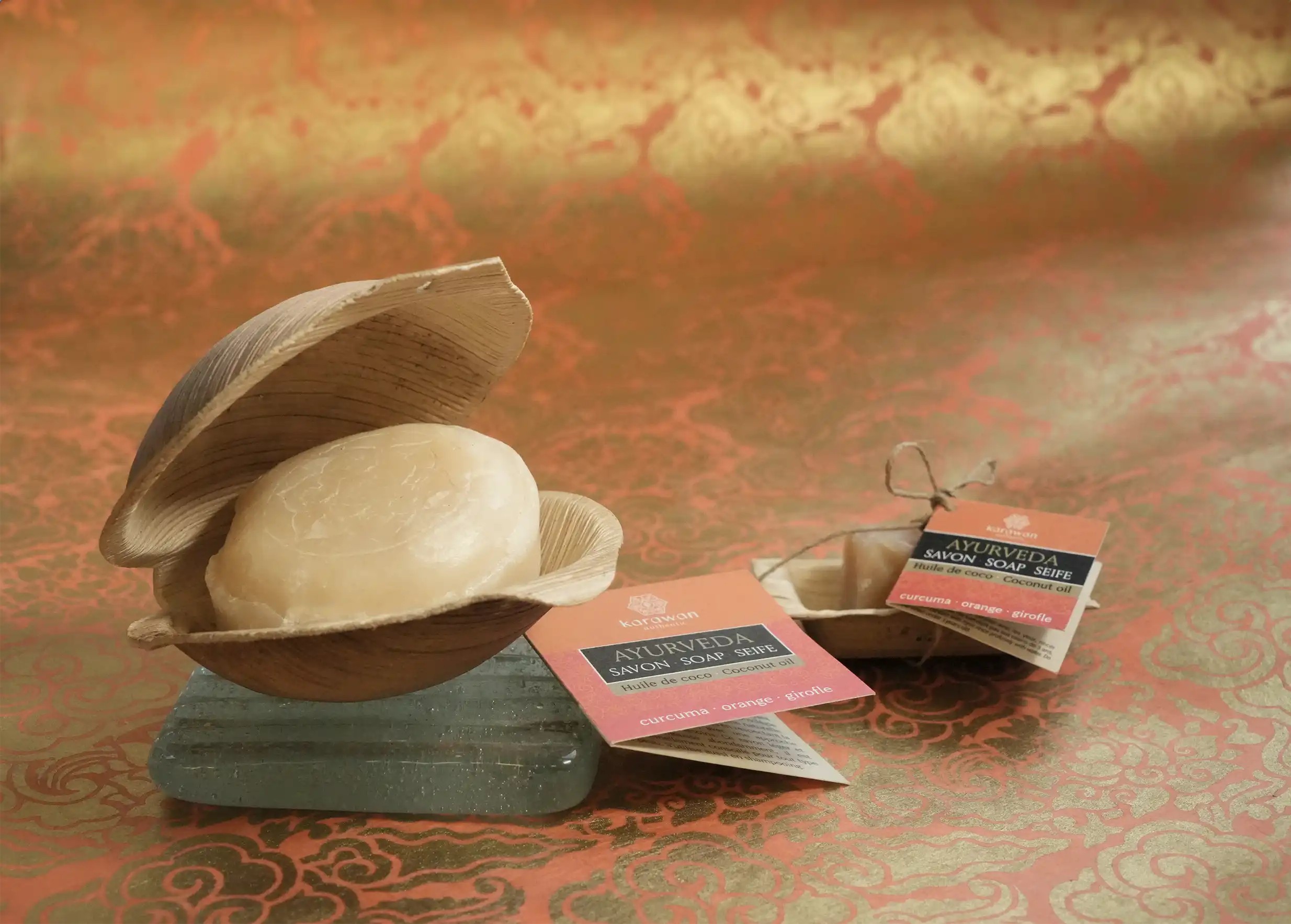 Ayurvedic turmeric soap in open shell, glass soap dish and 20g ayurvedic turmeric mini soap bar