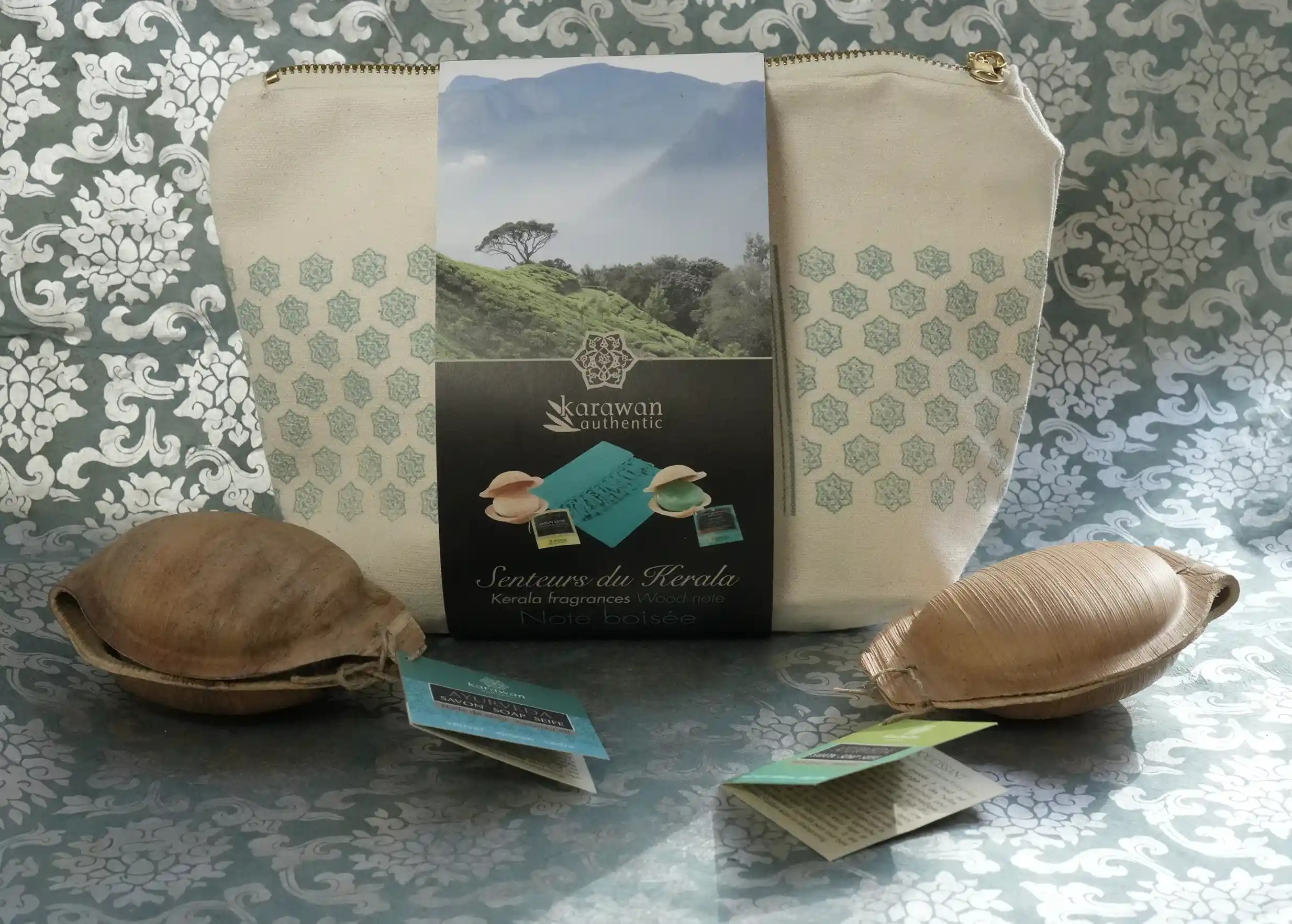 Kerala scent box with woody notes by Karawan, pouch, and ayurvedic soaps with their cardboard labels