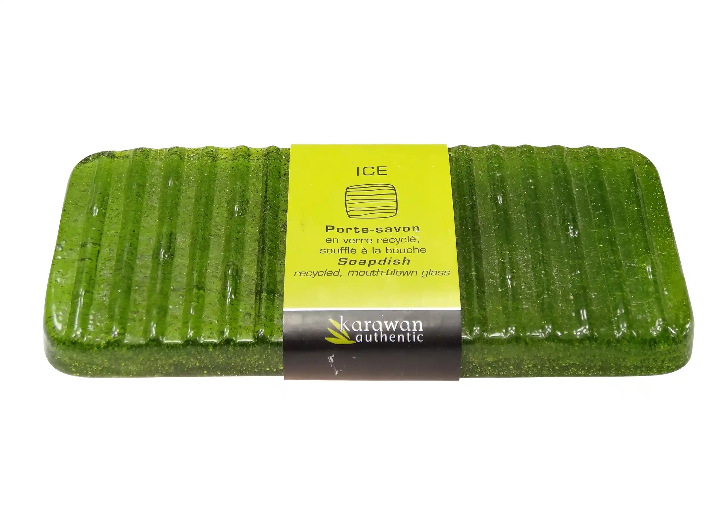 Ice recycled glass soap dish with ayurvedic soap and packaging on a white background