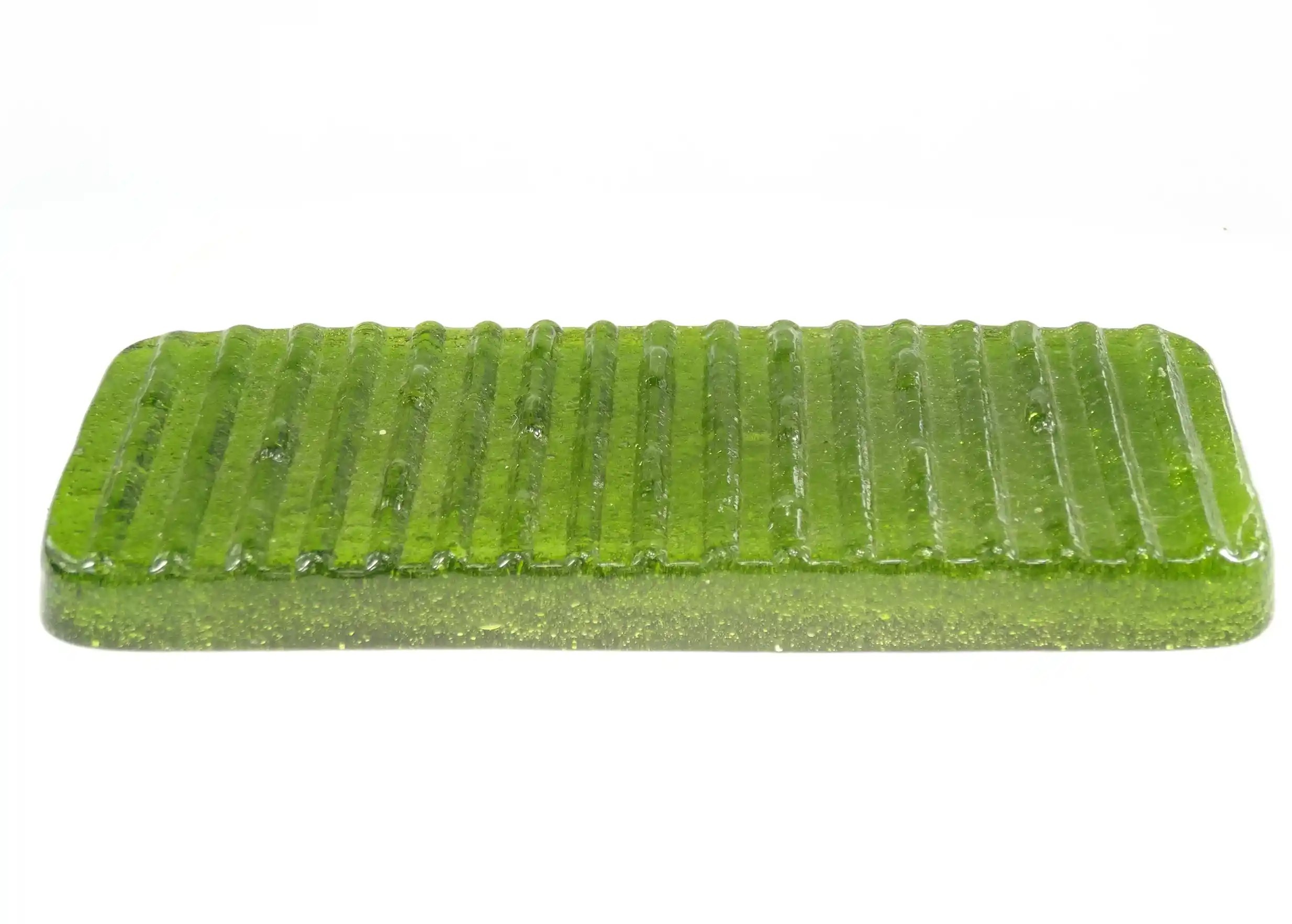 Ice recycled glass soap dish with ayurvedic soap on a white background