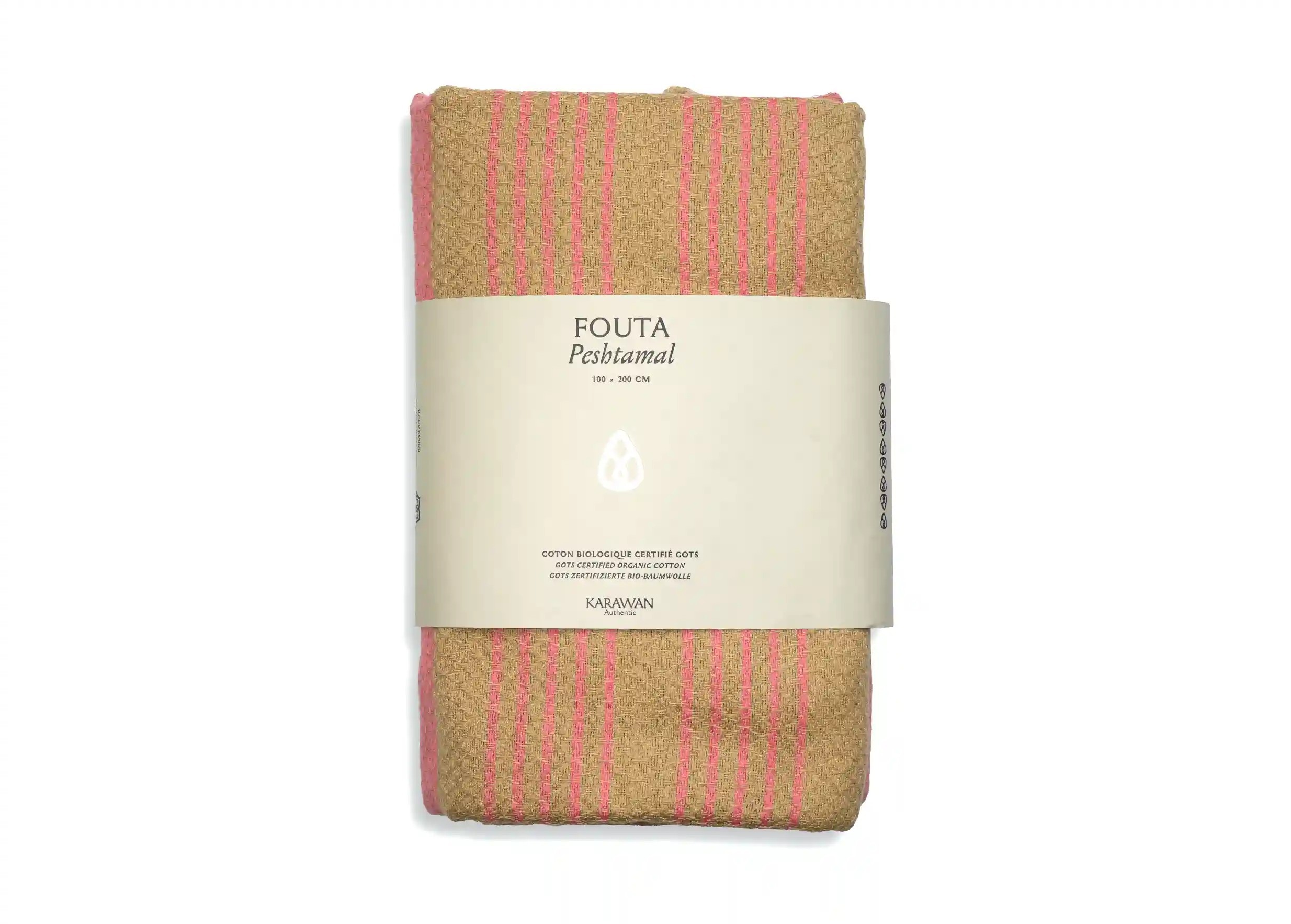 Indian pink coloured organic cotton fouta from the Sand collection, packshot photo with packaging band