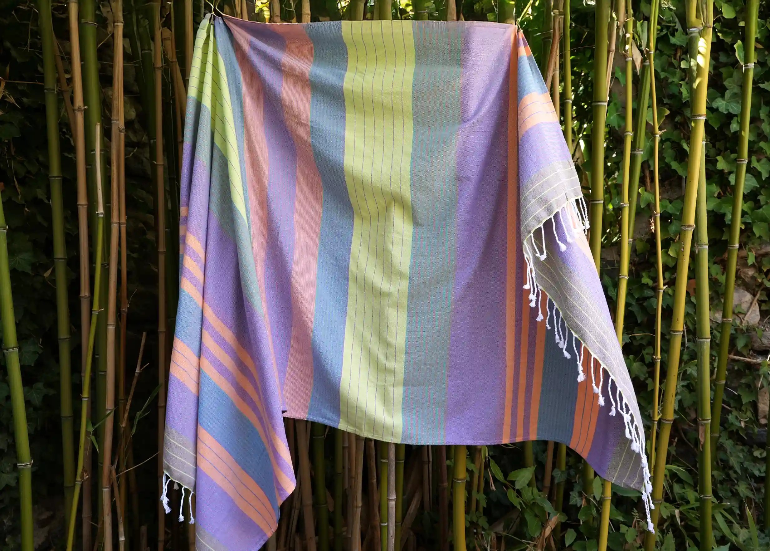 Purple sun coloured organic cotton towel, featuring bright, warm colours