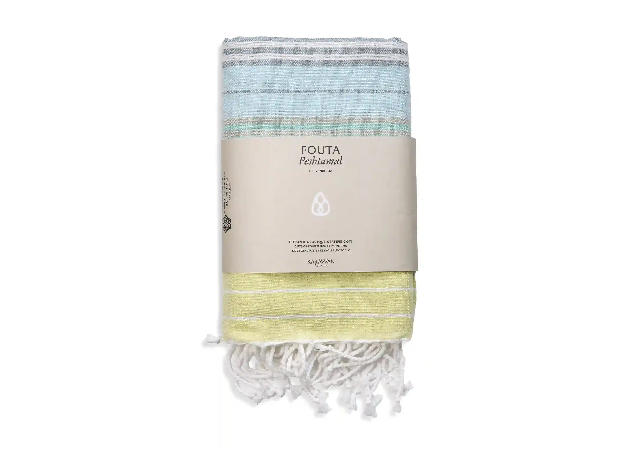 Sunny lime coloured organic cotton fouta from the Sud collection, packshot photo with packaging band