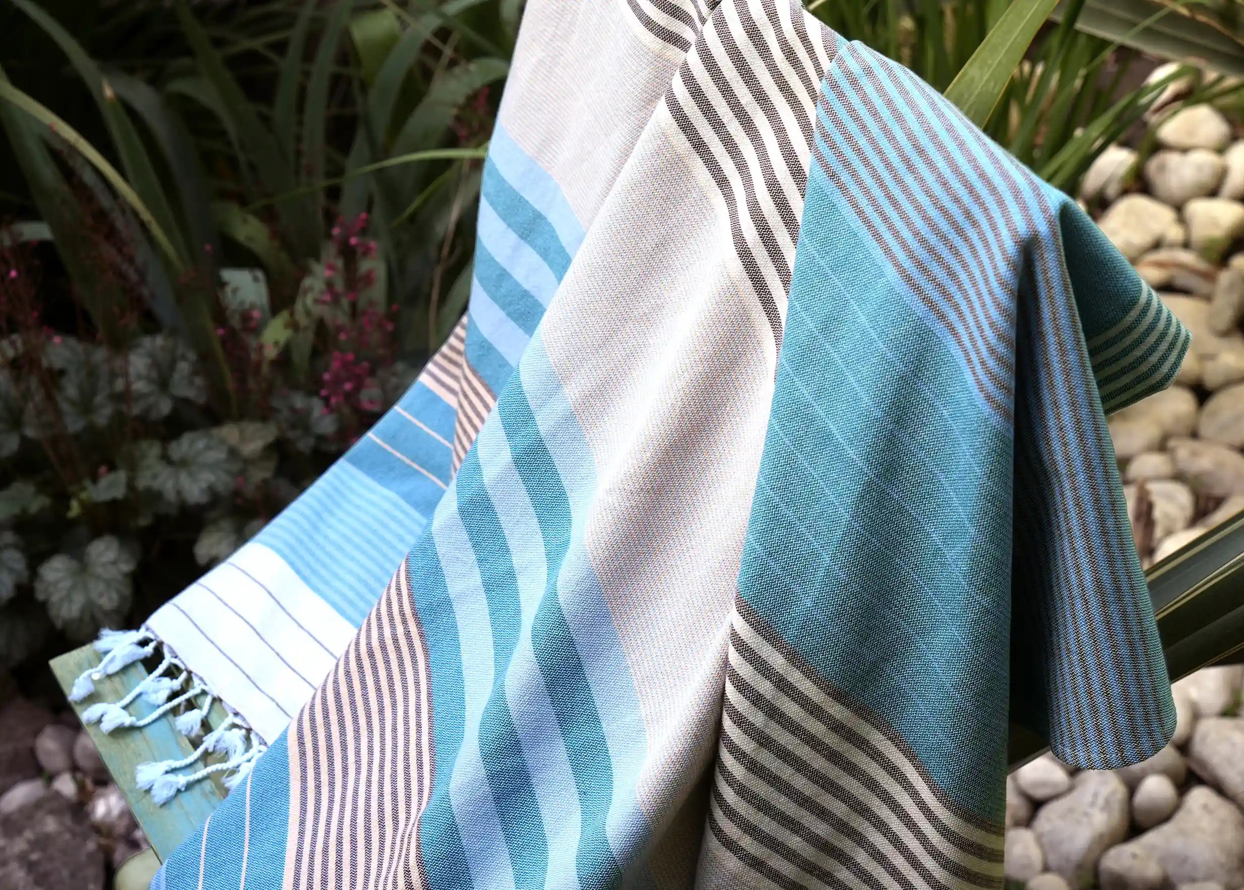 Waves-coloured cotton blanket on a chair