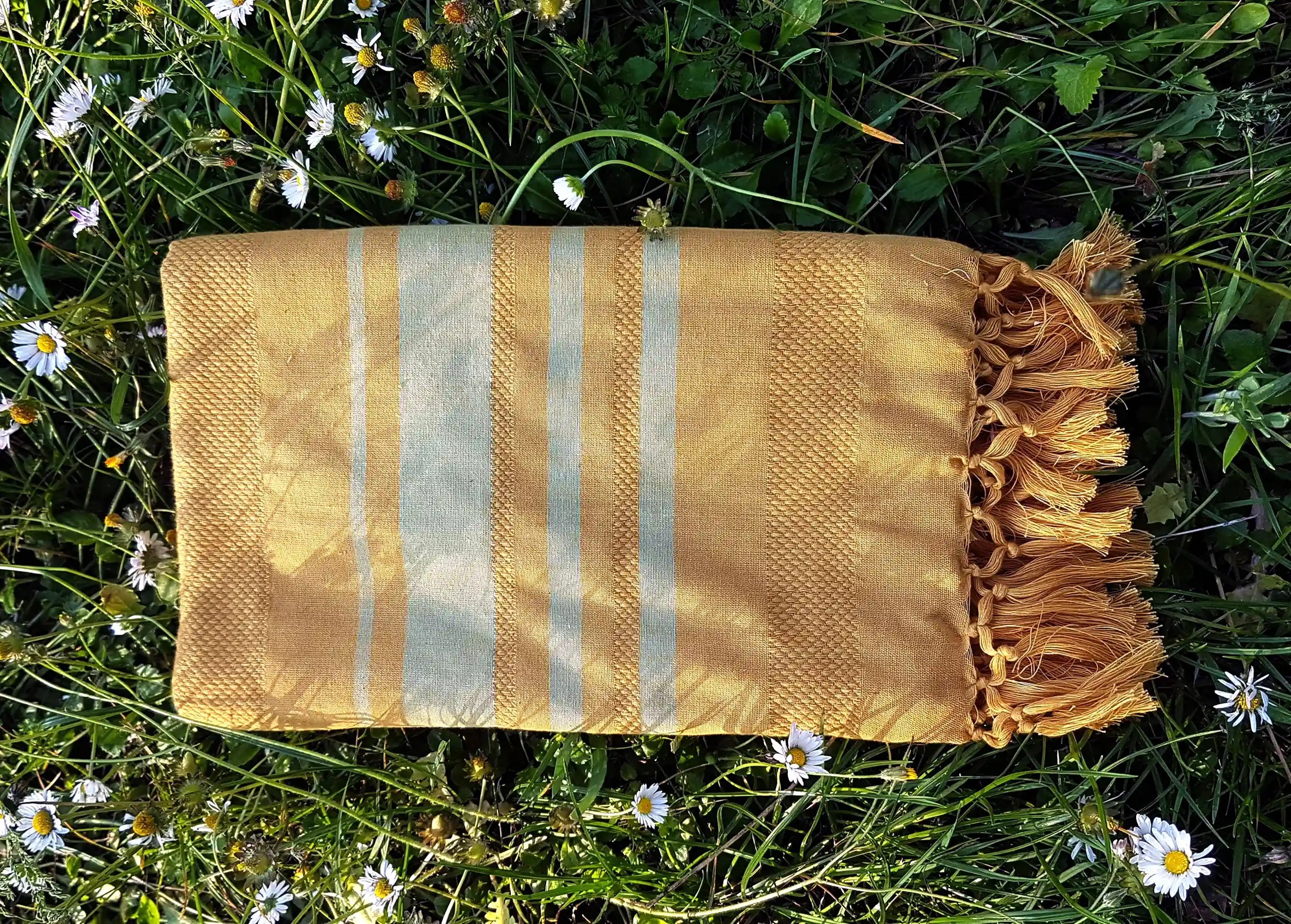 Yellow-coloured fouta with alternating two-tone stripes