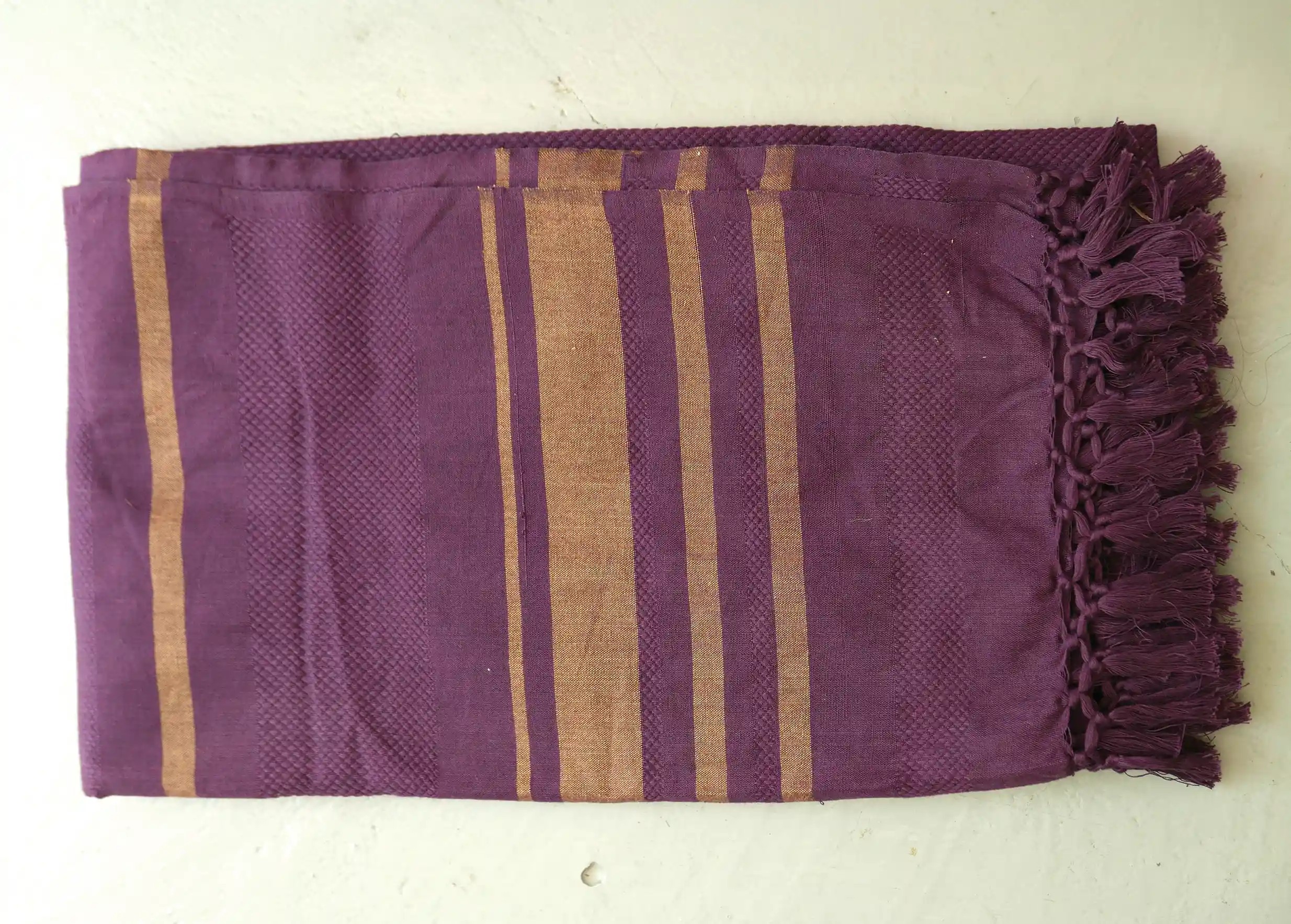 Purple-coloured cotton towel with brown stripes