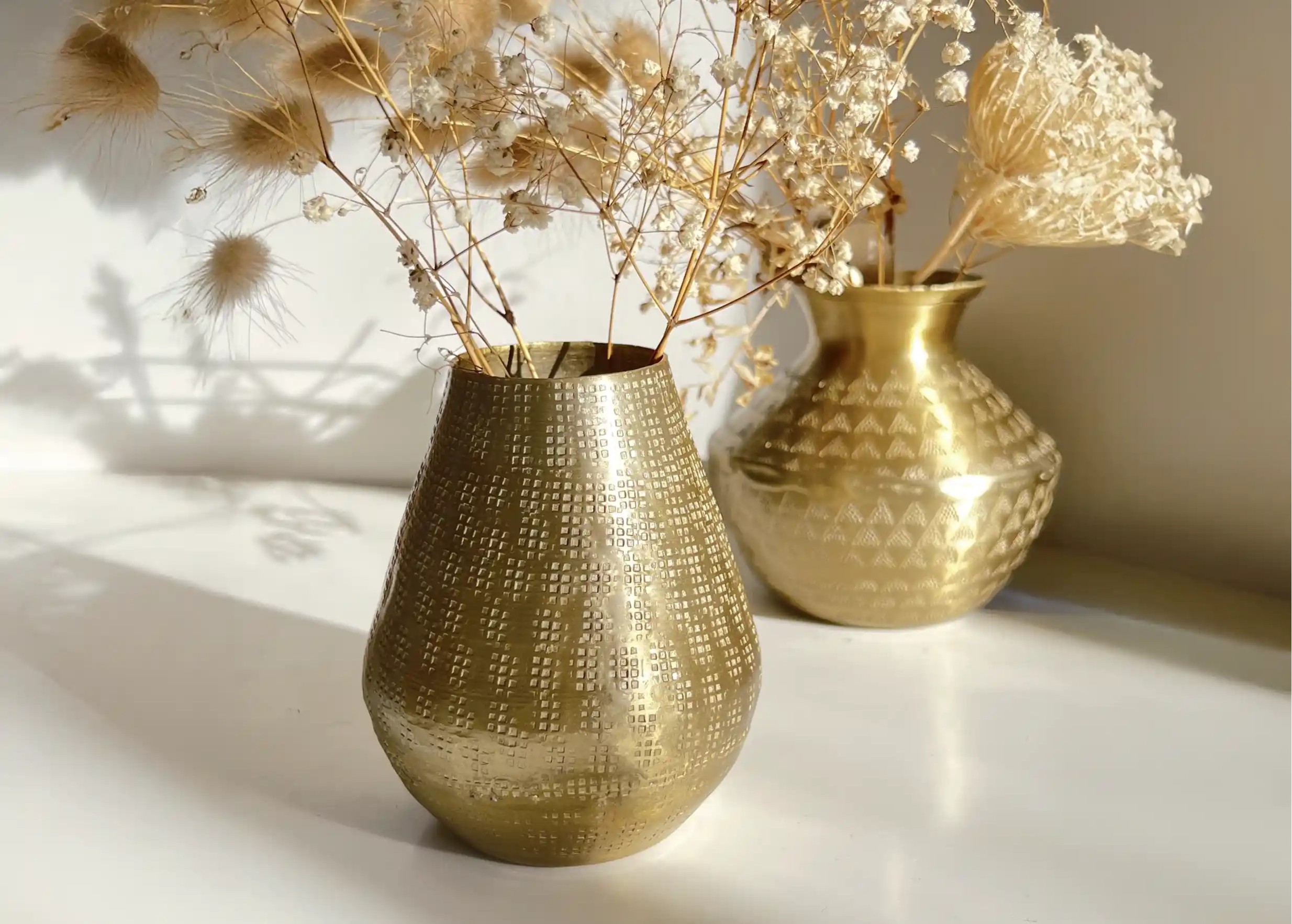 Set of decorative vases for the home, small aluminium vase with engraved motifs, and large vase with dried flowers