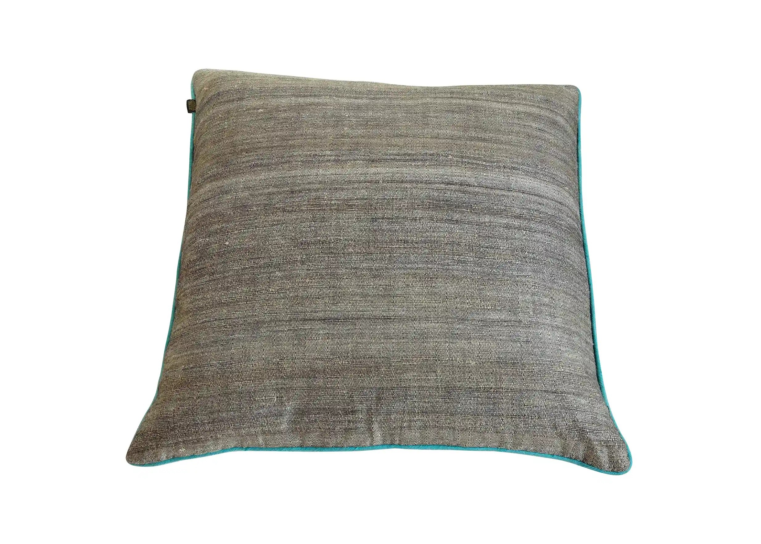 Square turquoise cushion in nettle fiber and wild silk, photo taken from behind on a white background