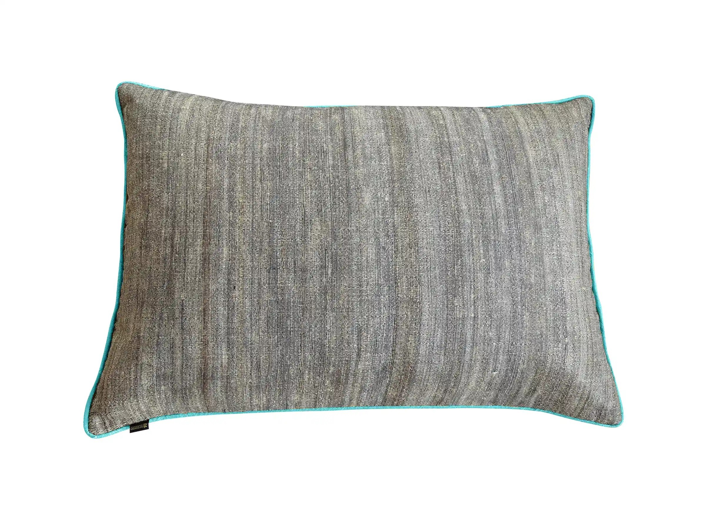 Rectangular turquoise cushion made of nettle fiber and wild silk, photo taken on a white background