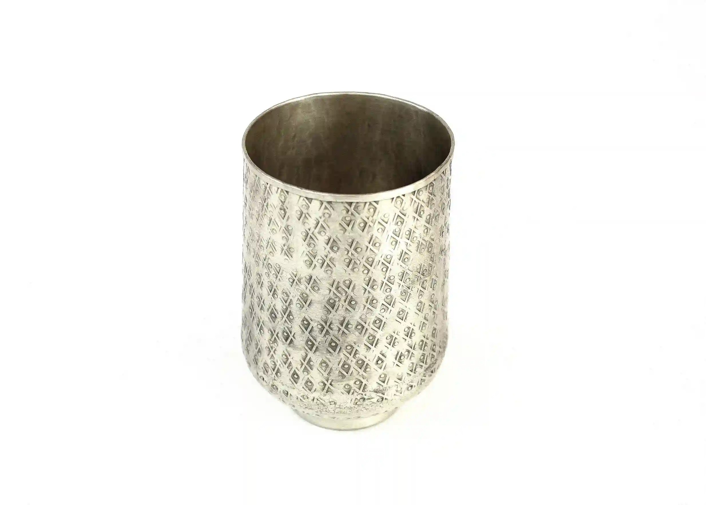 Silver-plated brass glass with engraved Karawan authentic motifs, photo taken against a white background