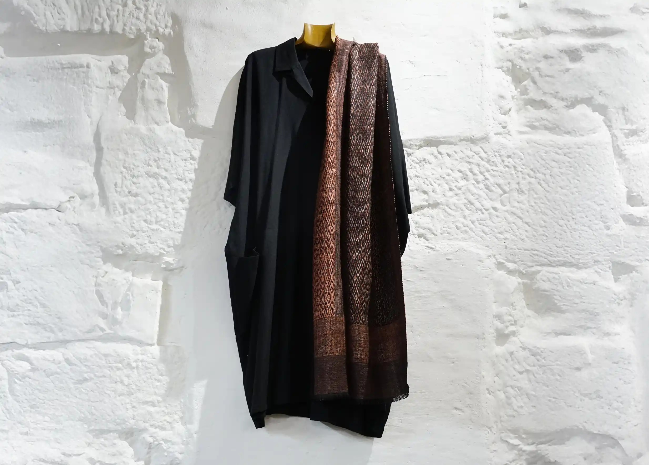 Eri wild silk stole, clay colour, worn over the side of a black tunic