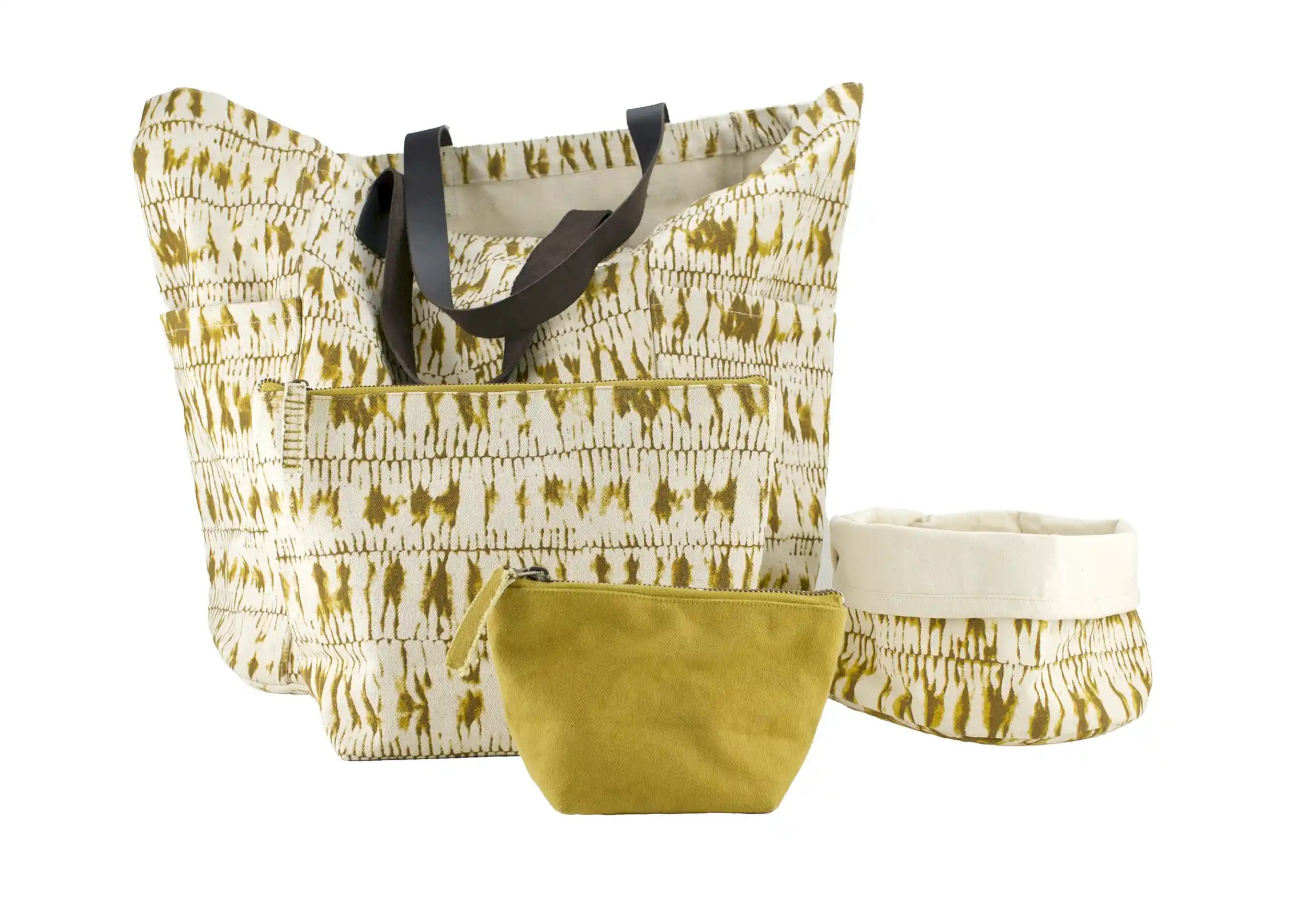 Several products from the Shade saffron range, bag, pencil case and pocket divider, photo taken against a cut-out background