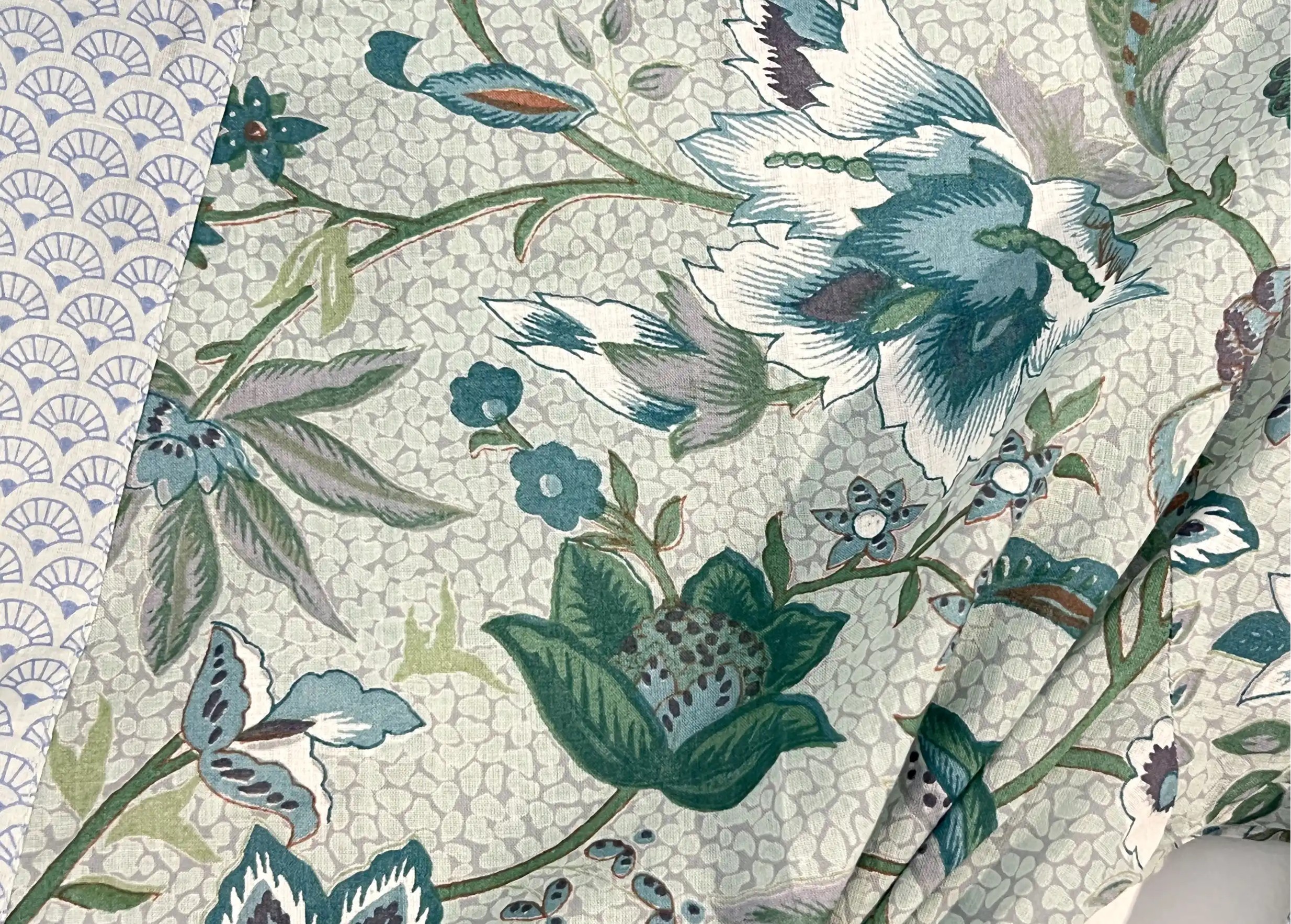 Focus on the Blue Garden cotton kimono, featuring blue and green floral motifs on a light background