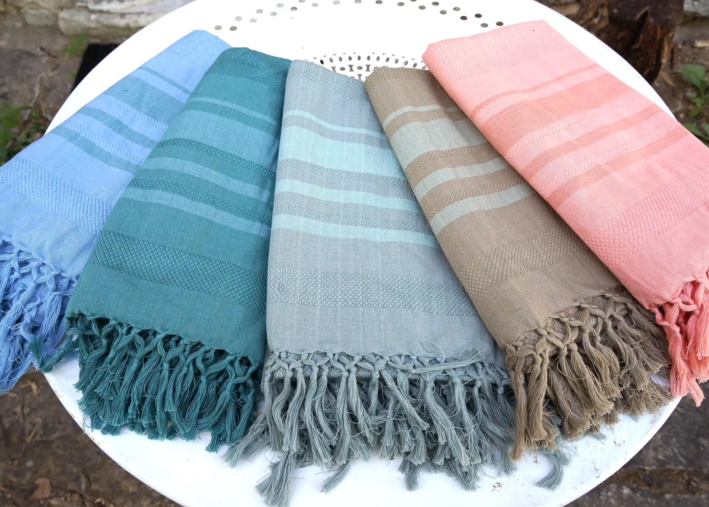 Set of foutas from the Garden collection on an outdoor table