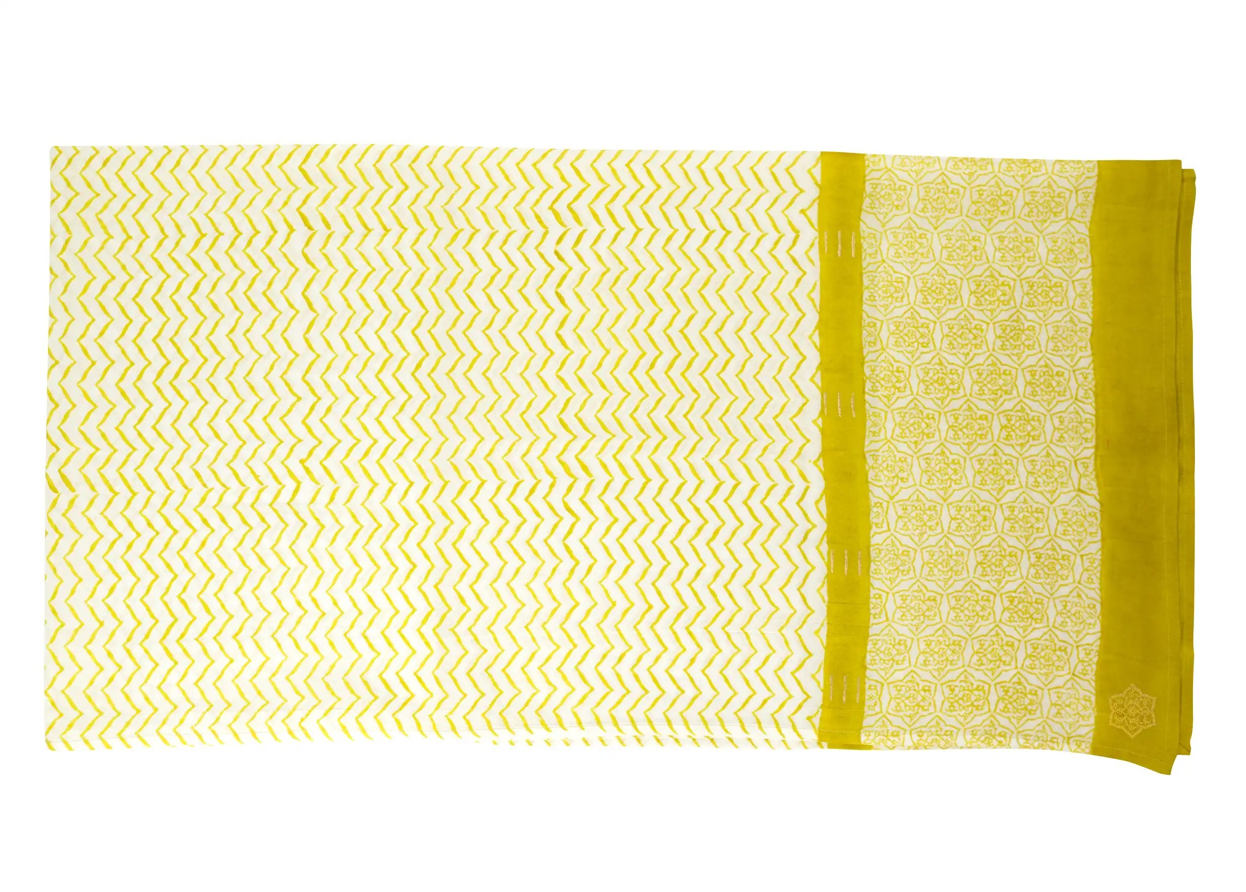Focus on the details of the ‘Zigblock’ cotton pareo, block-printed in curry colour.