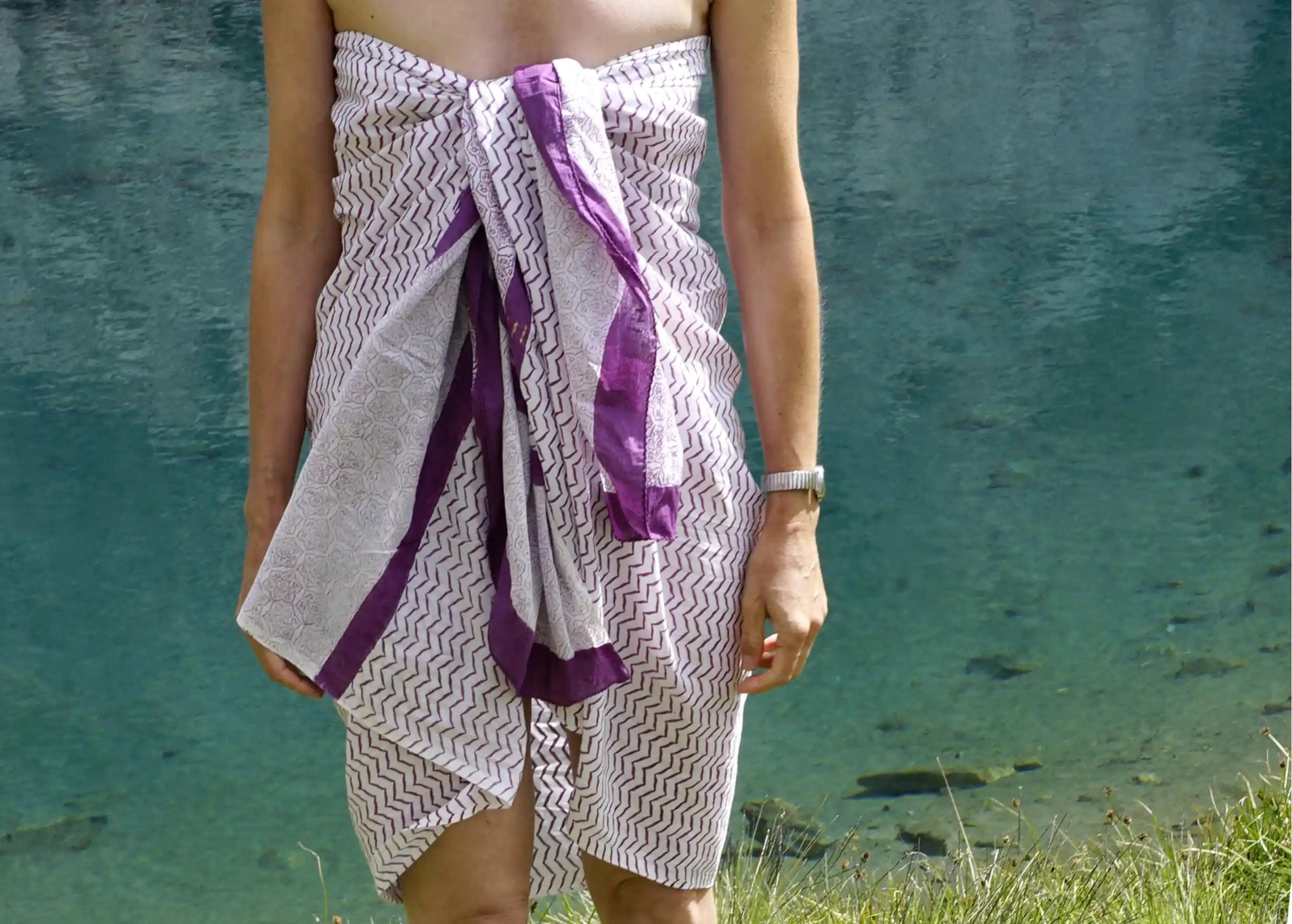 Woman wearing a red block-printed Zigblock pareo tied around her waist