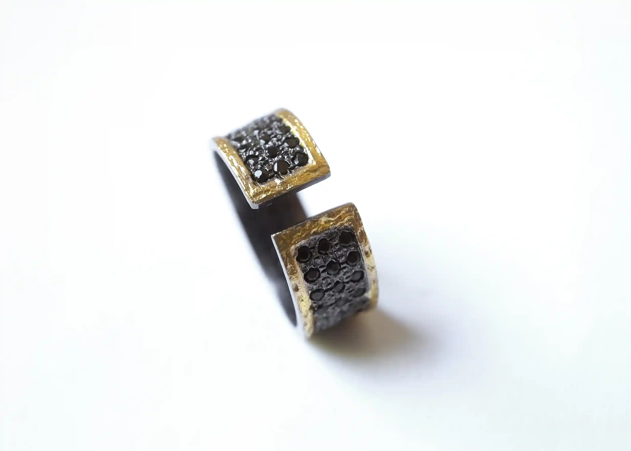 Adjustable brass and zirconium back ring Dawn of Time collection on a white background