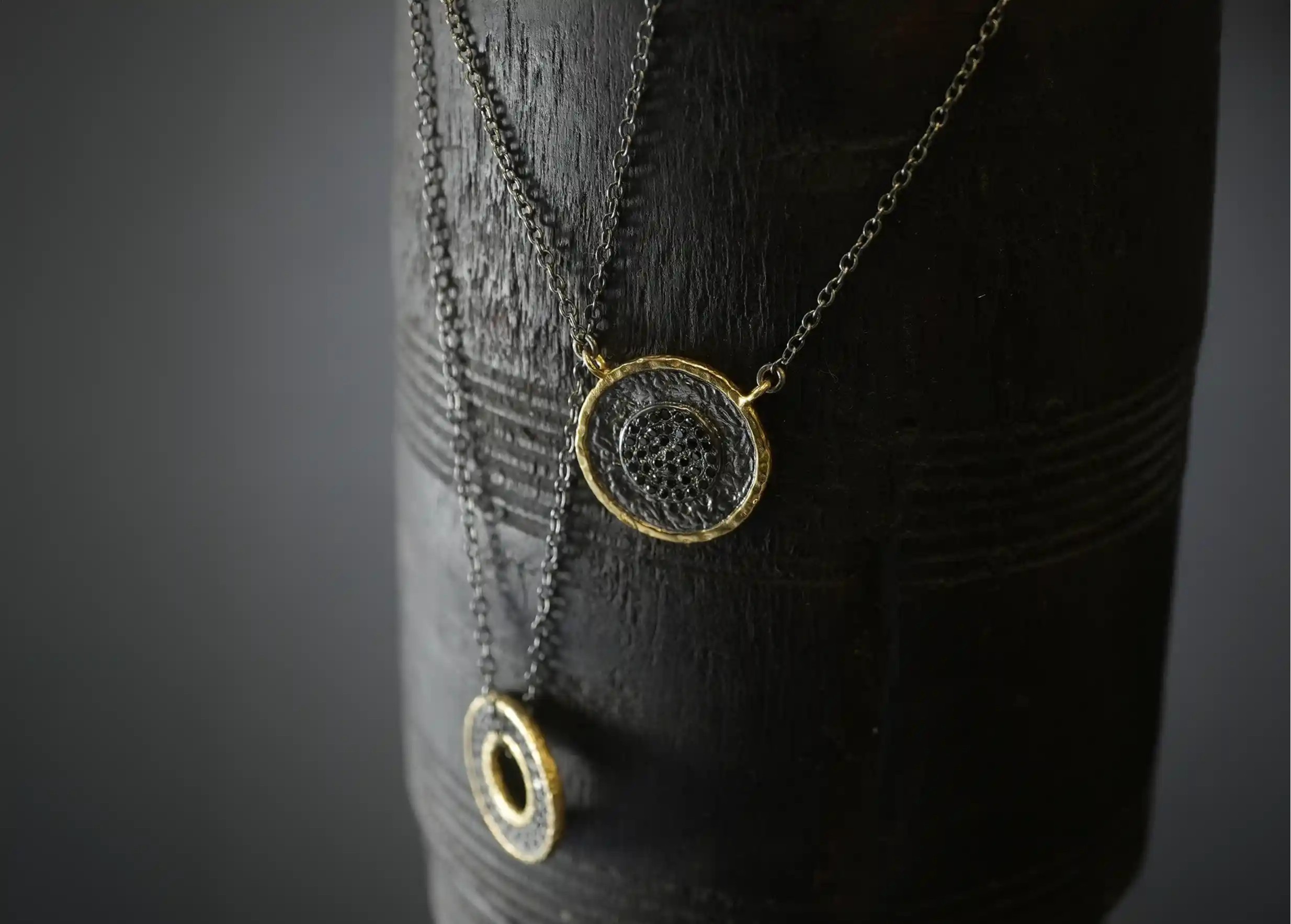 Suspended pendants in gilded-plated brass and zirconium, jewellery by Karawan