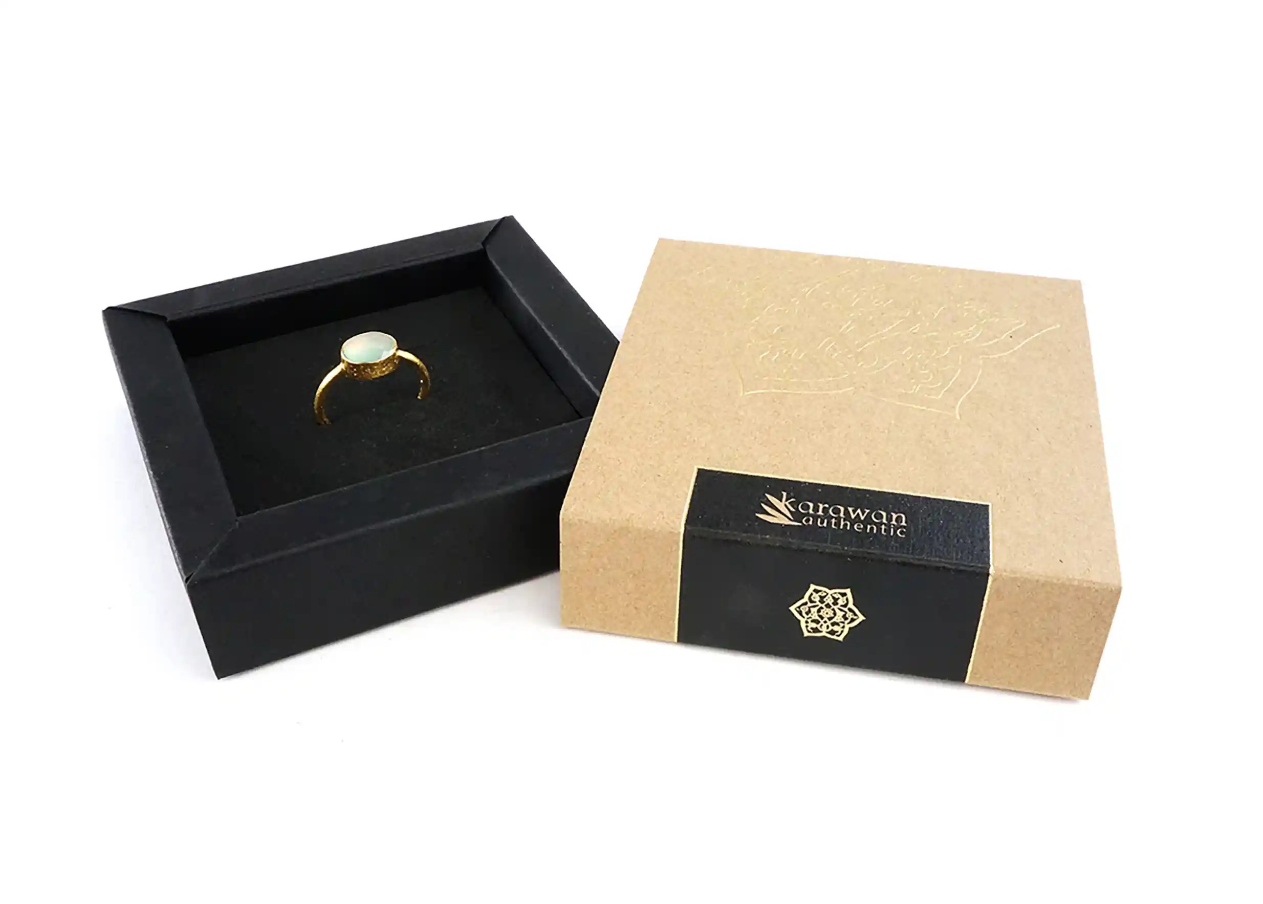 Gold-plated ring from the Yamuna collection in its gift box, photo taken against a white background