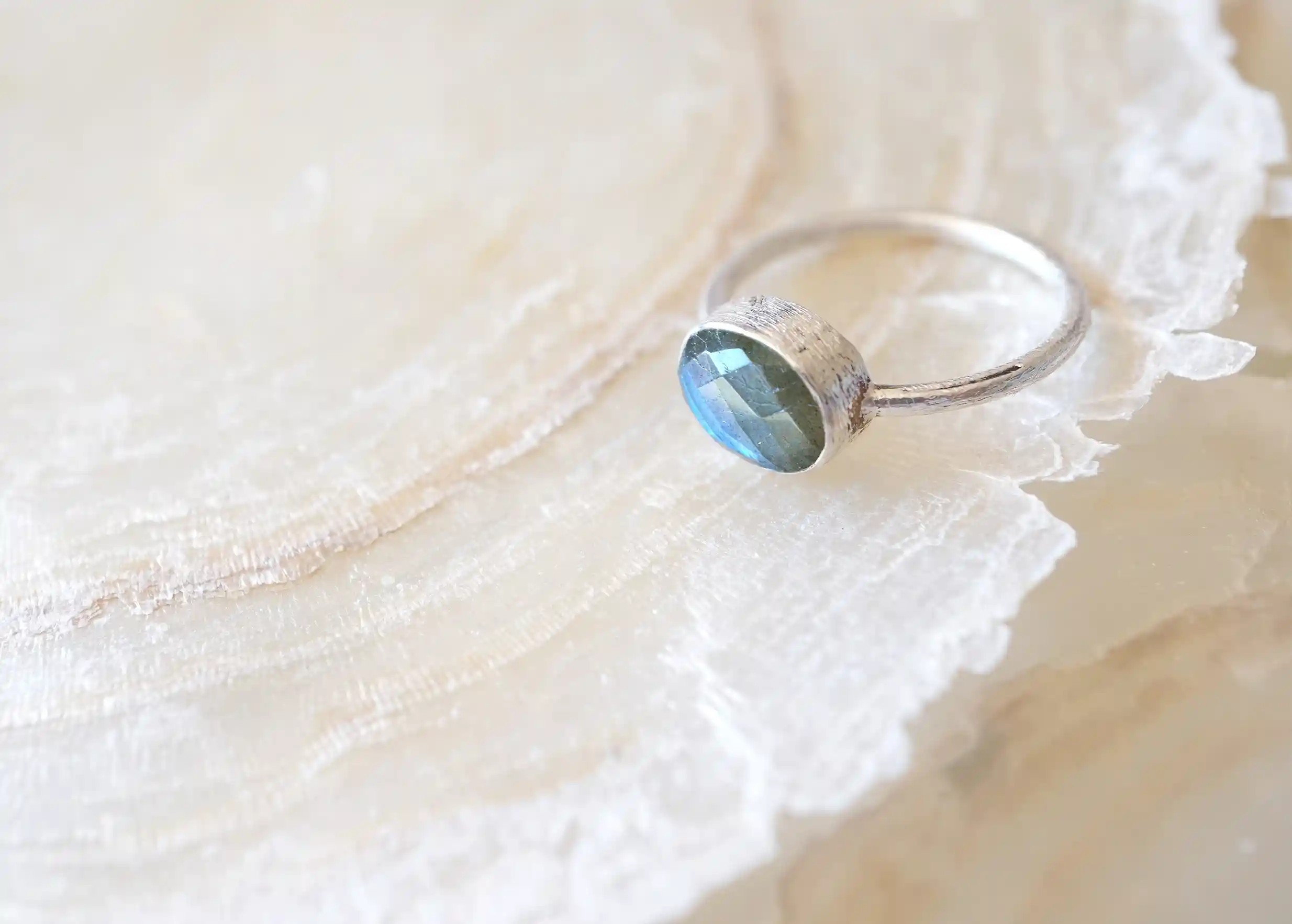 Silver and labradorite ‘Drop’ ring, Yamuna collection, labradorite displayed on a stone