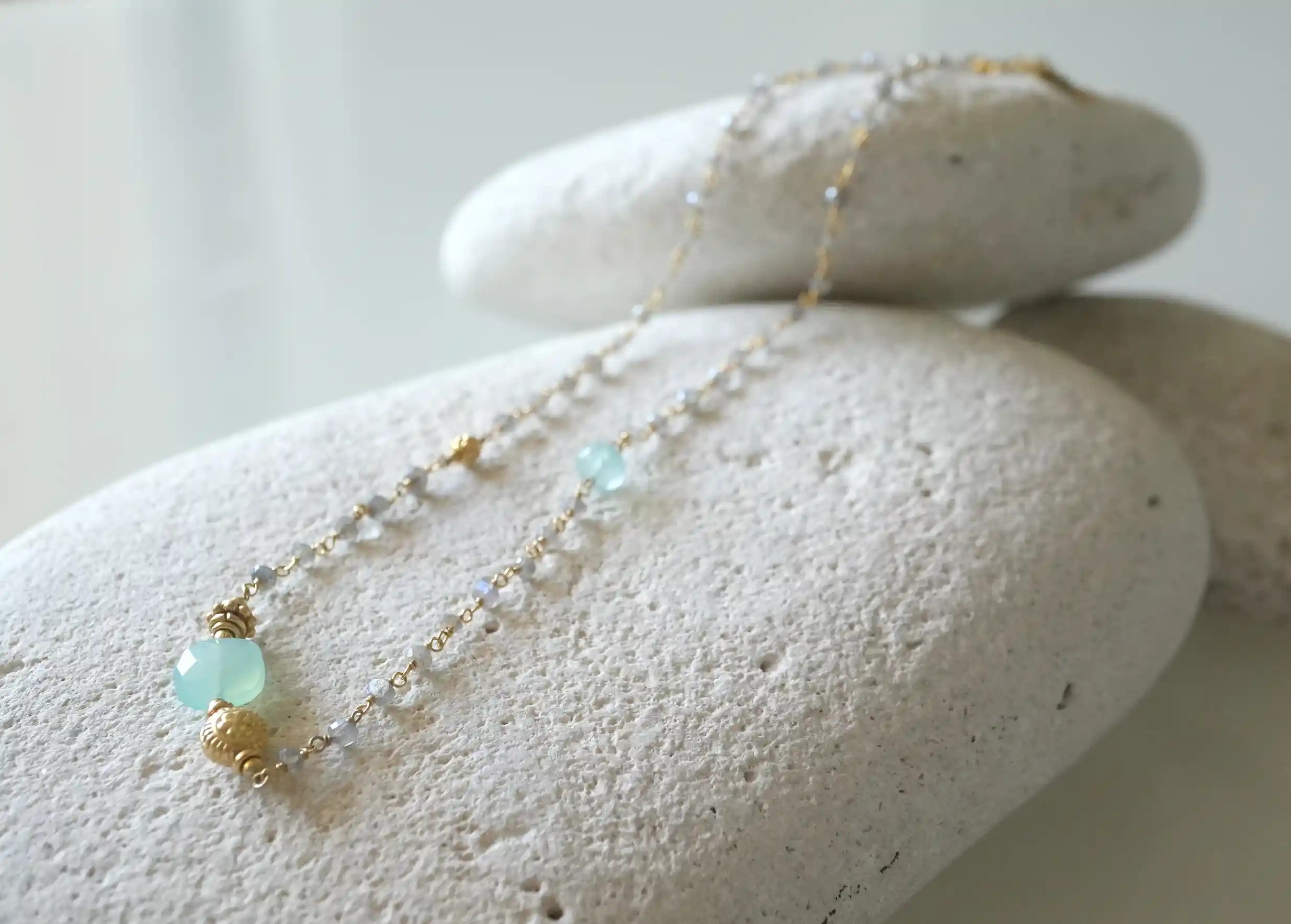 ‘Ani’ gold-plated necklace with aqua chalcy and labradorite stones, from the Karawan Authentic brand.