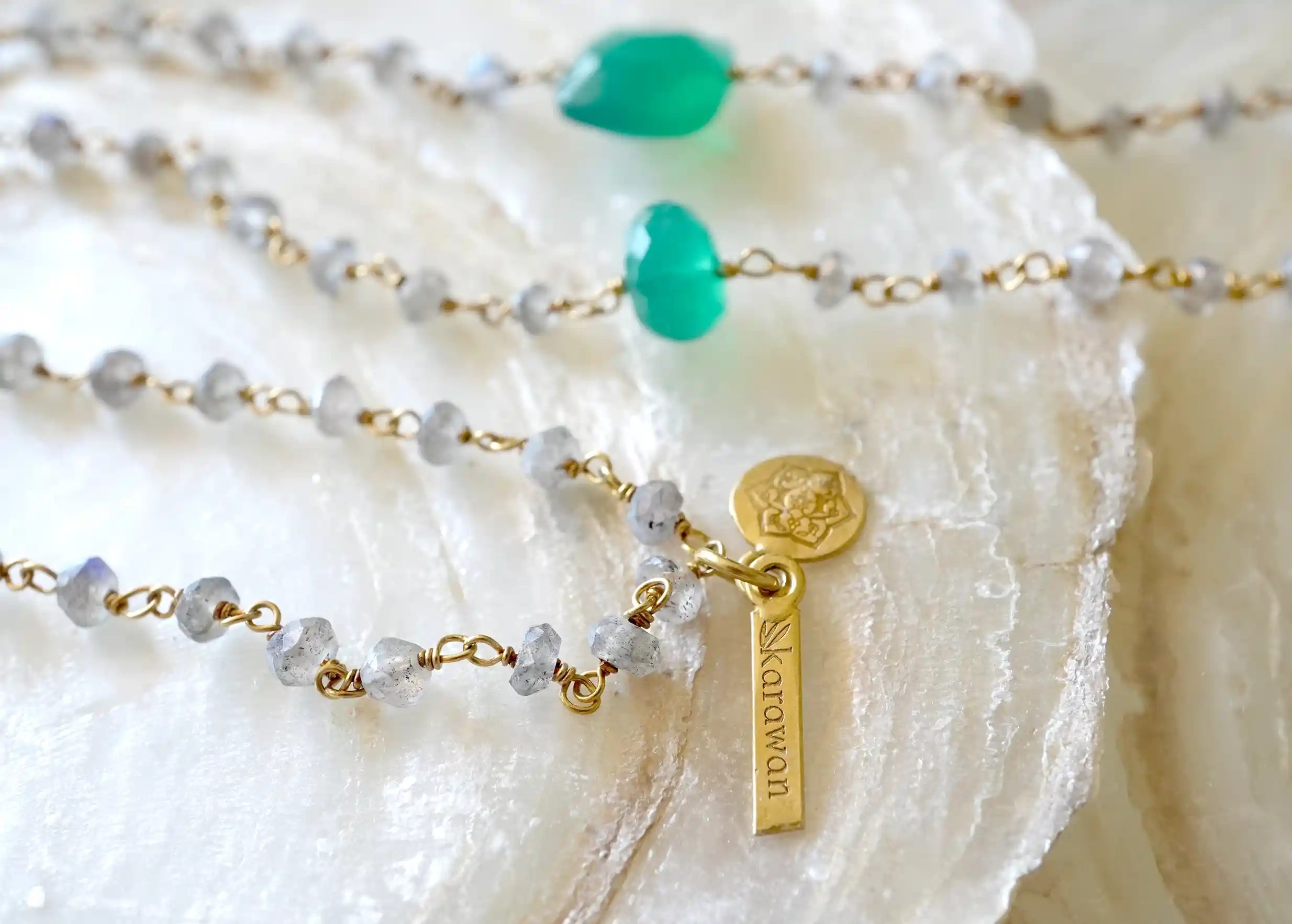 Focus on the details of the ‘Ani’ gold-plated necklace & green onyx and labradorite stones, Yamuna collection