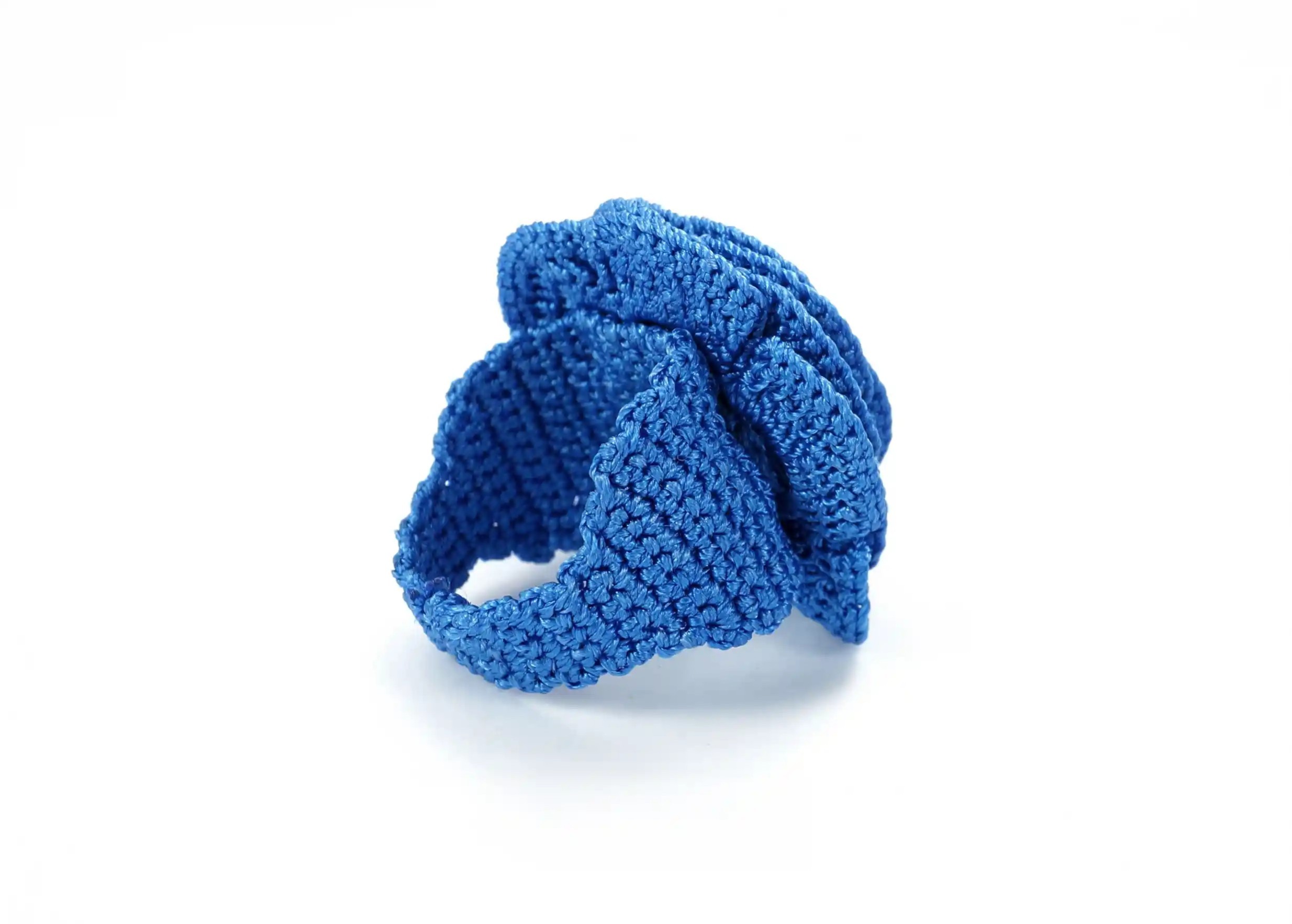 Belkis lace ring in indigo on a white background