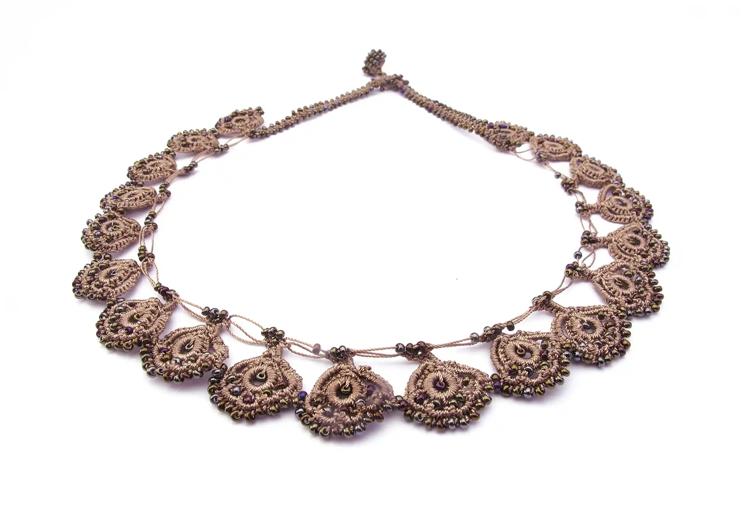 Golden sand lace necklace from the Eda range, shown almost in full on a white background.