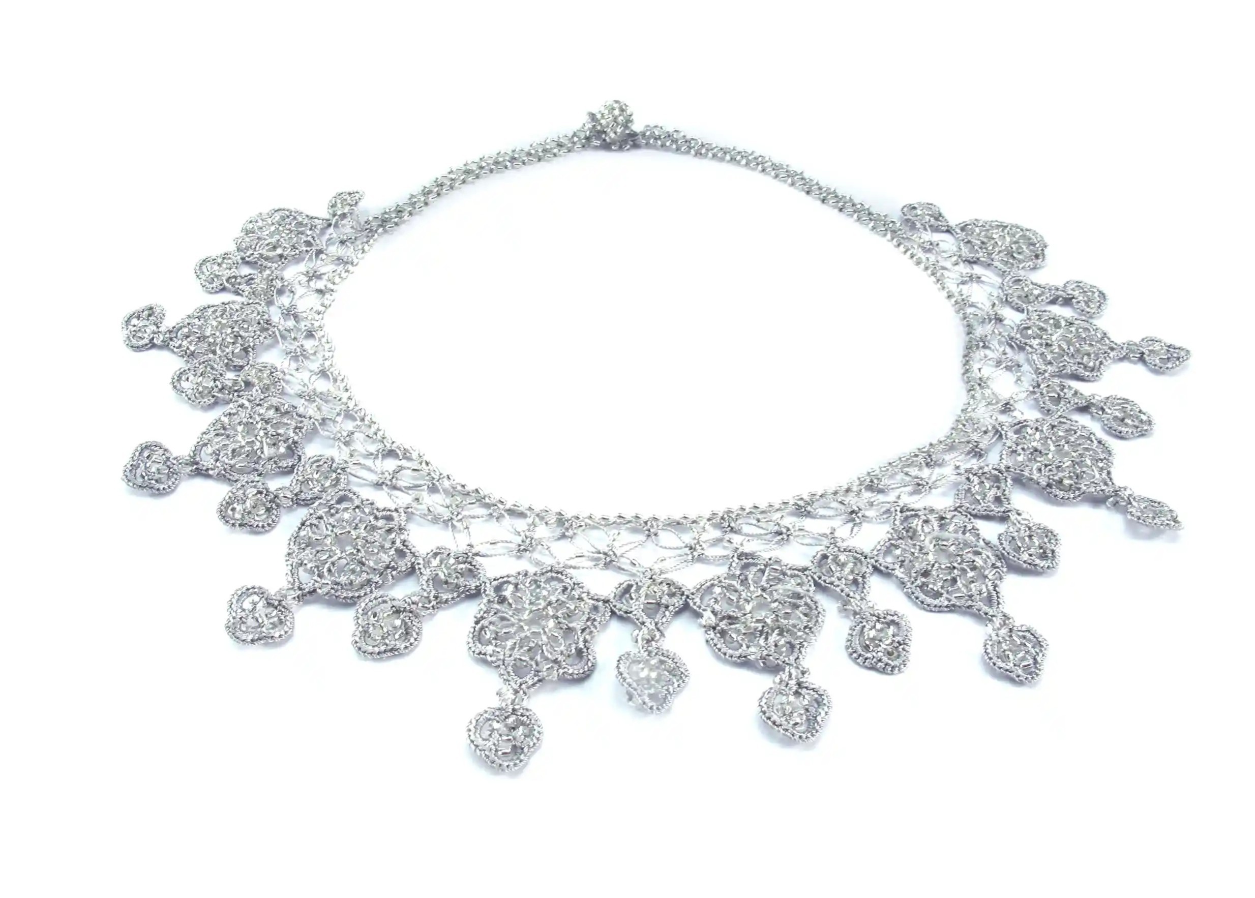 Sonya lace necklace by Karawan, in cloud grey, laid flat on a white background