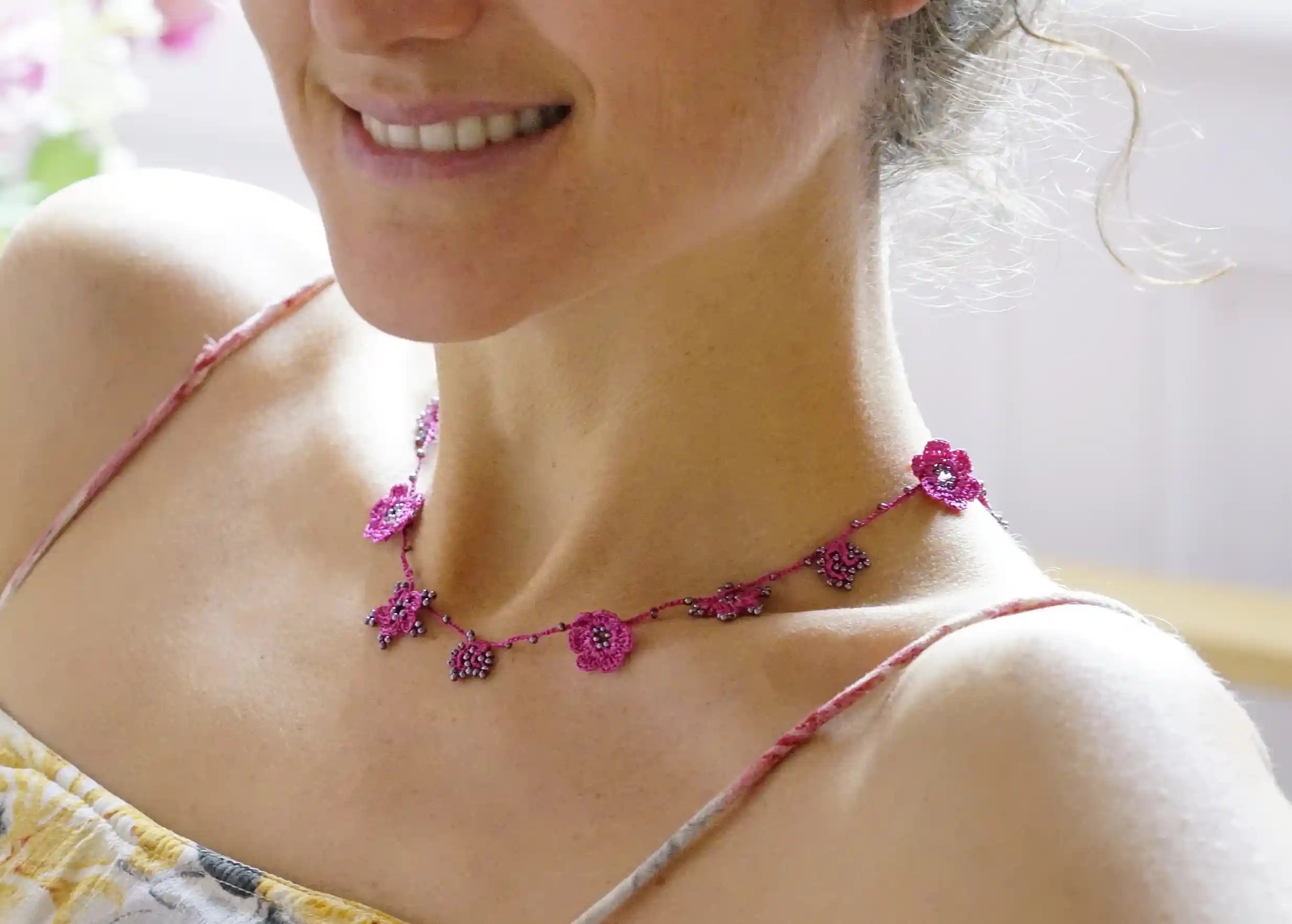 Crystal lace choker in bergamot colour, worn around the neck