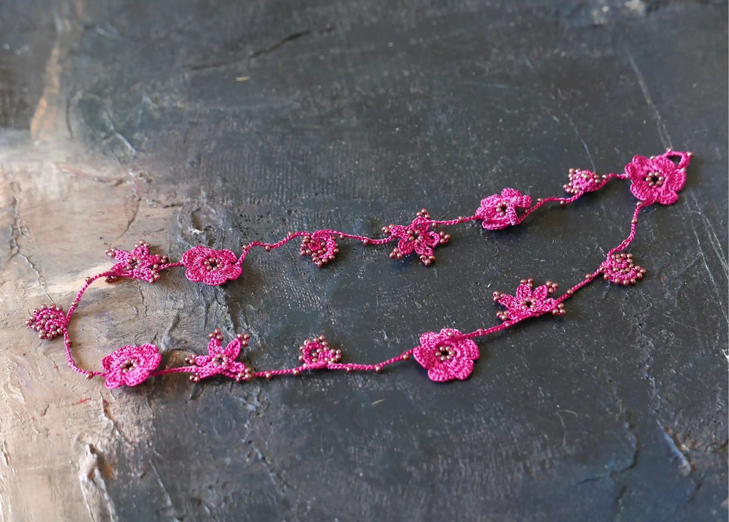 Bergamot-coloured Crystal lace choker on a textured background