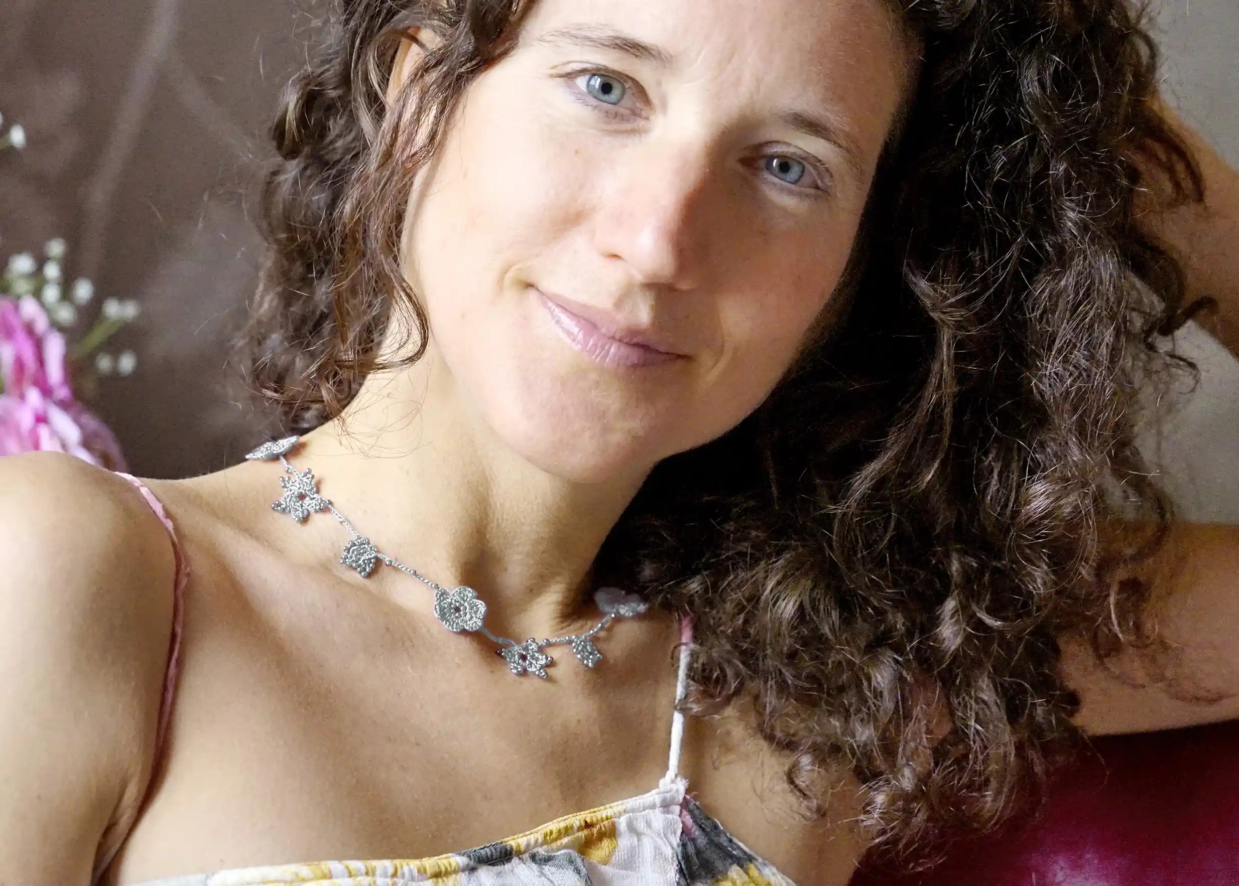 Crystal lace choker in cloud grey worn by a woman indoors
