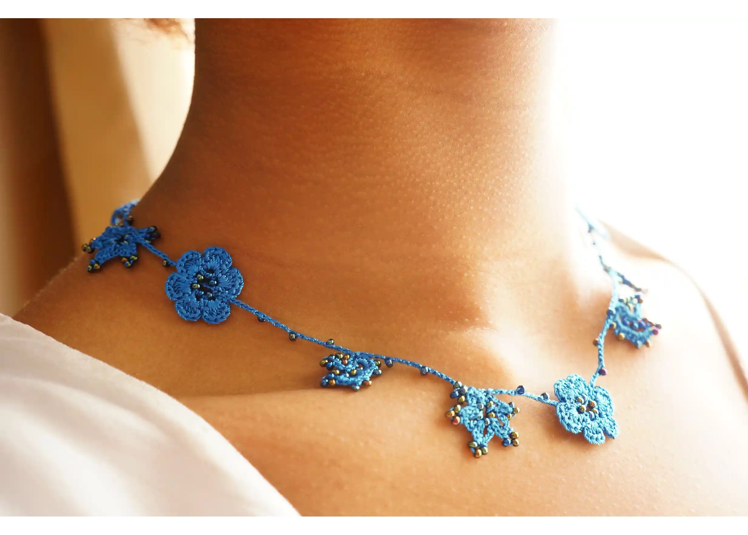 Crystal lace choker in indigo black, worn around the neck