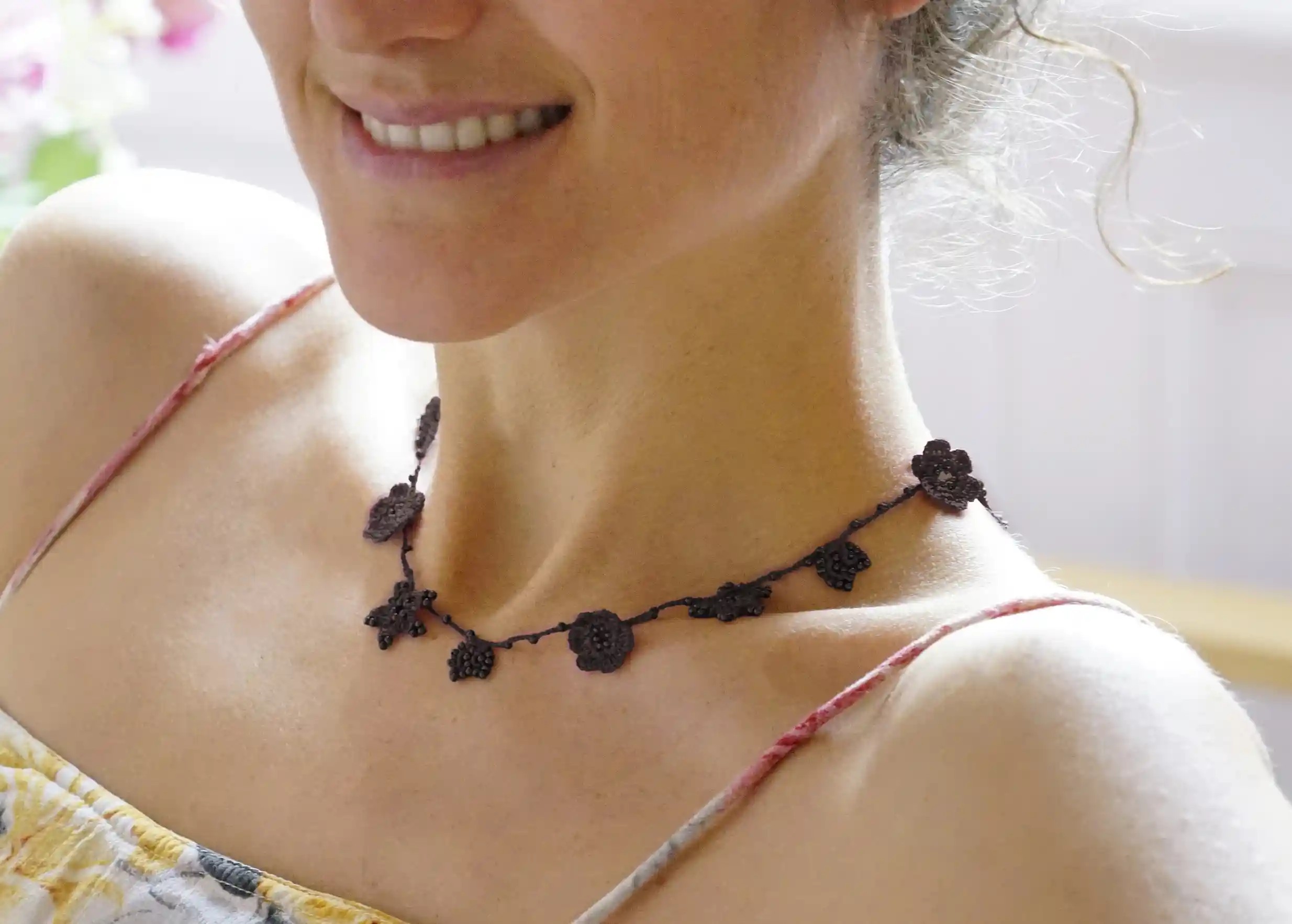 Black Crystal lace choker, worn around the neck