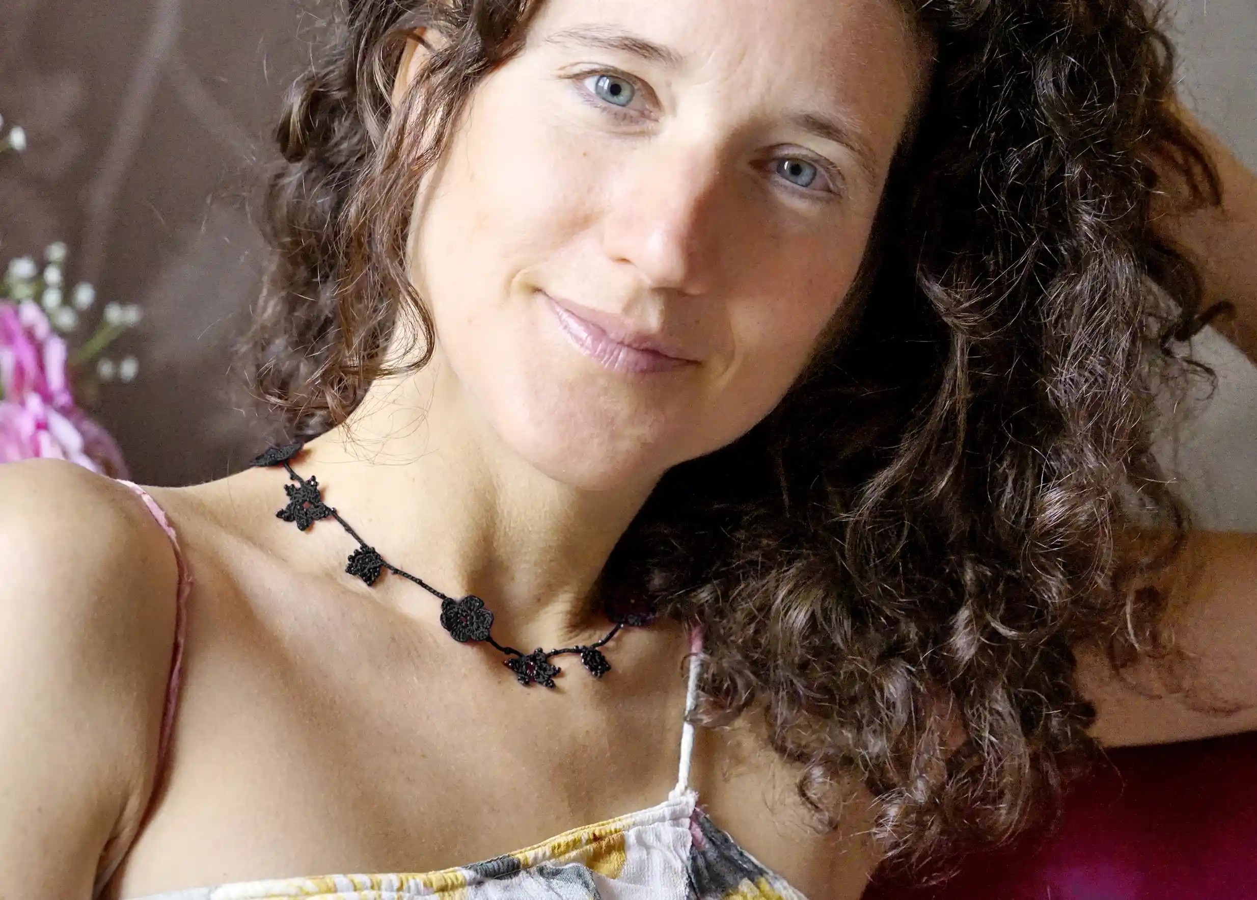Black Crystal lace choker worn by a woman indoors