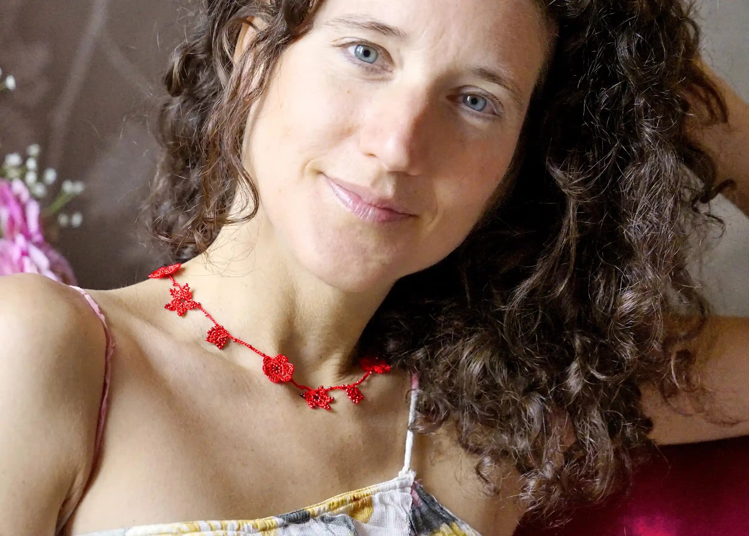 Red crystal lace choker, worn around the neck