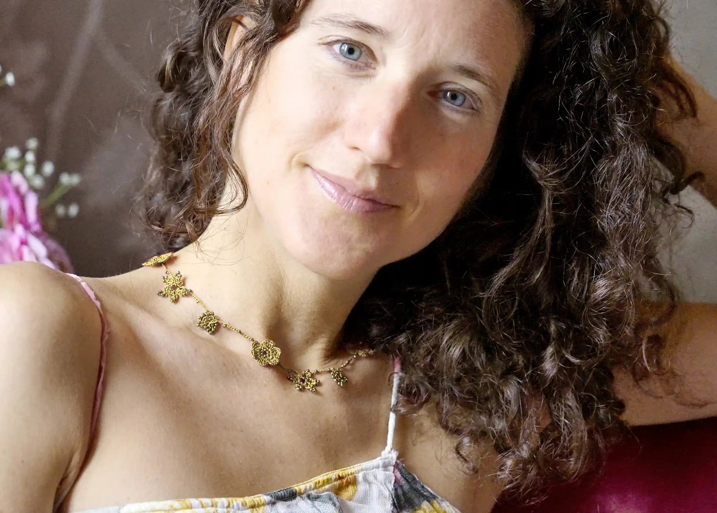 Crystal lace choker in lichen green worn by a woman indoors