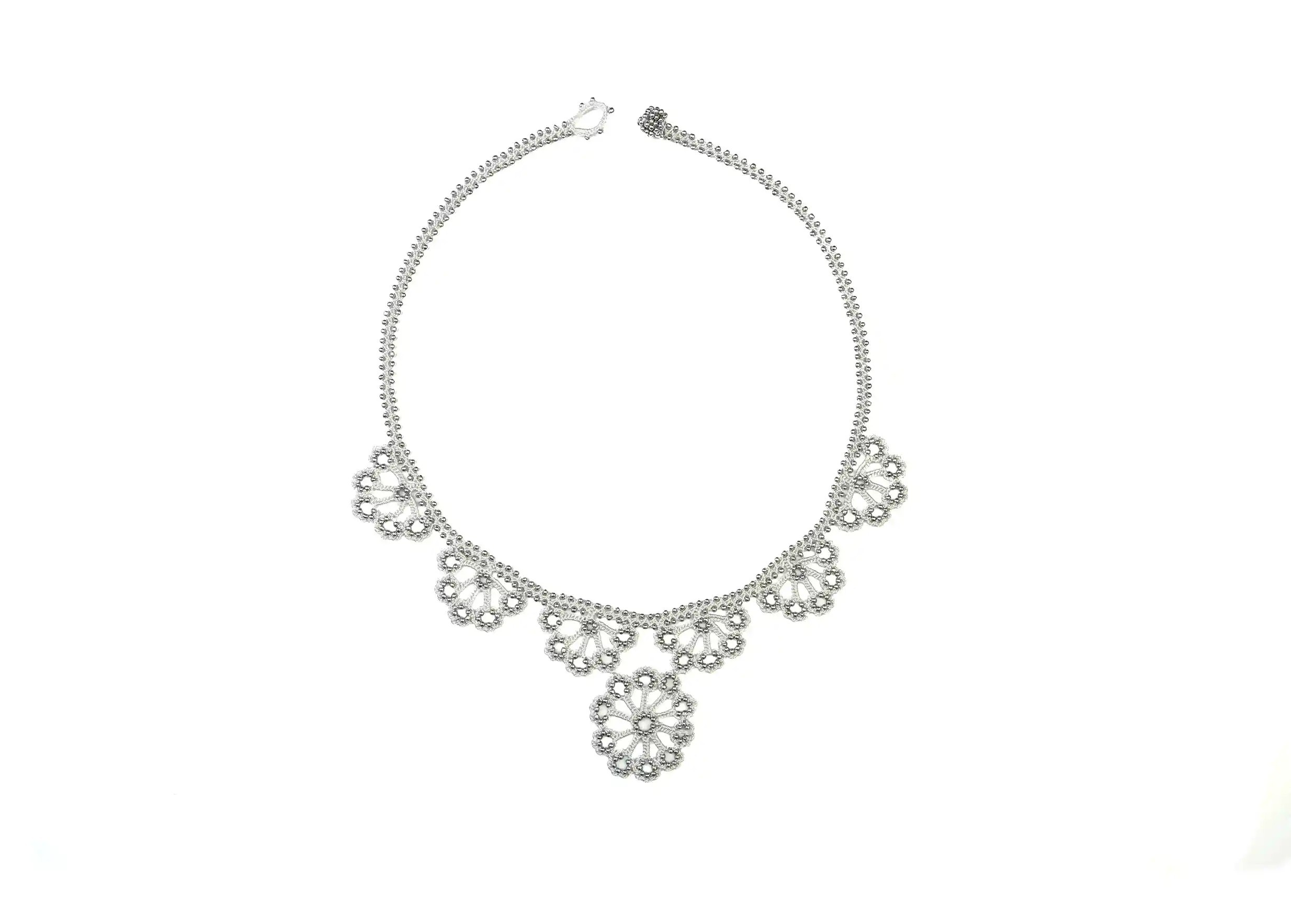 Hawa lace necklace, silver grey colour, on a white background