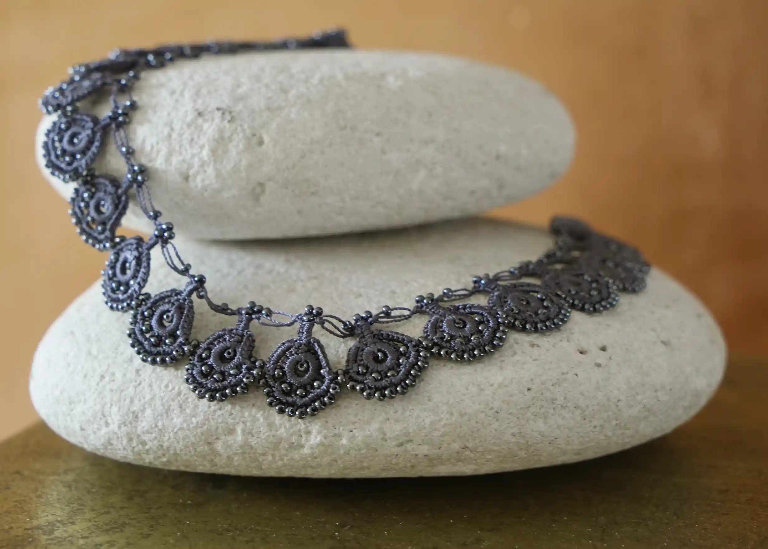 Close-up of the handmade lace on Karawan's Eda Slate Blue necklace