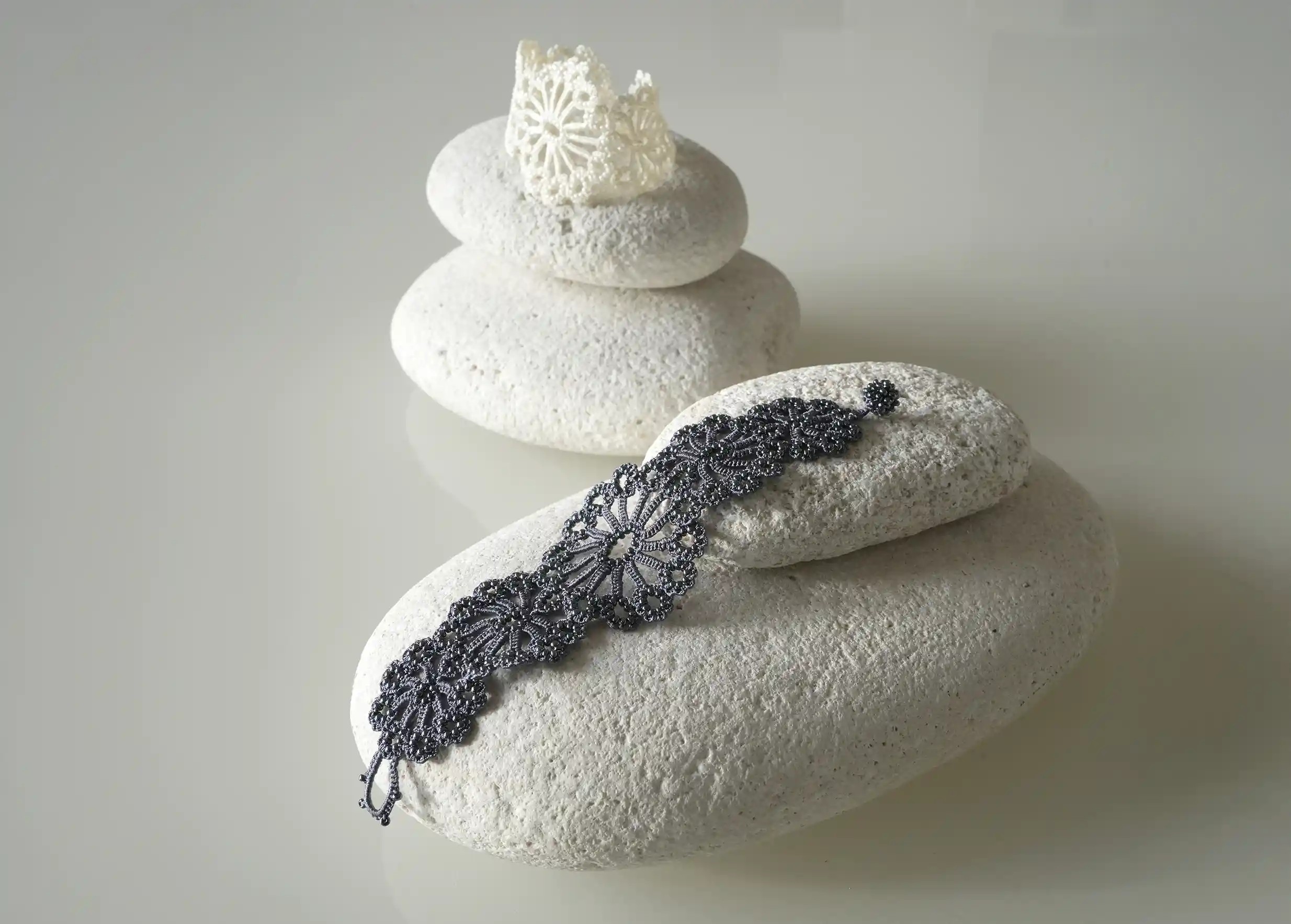 Set of two colours, slate blue and ivory, from the Hawa handmade bracelet collection by Karawan.