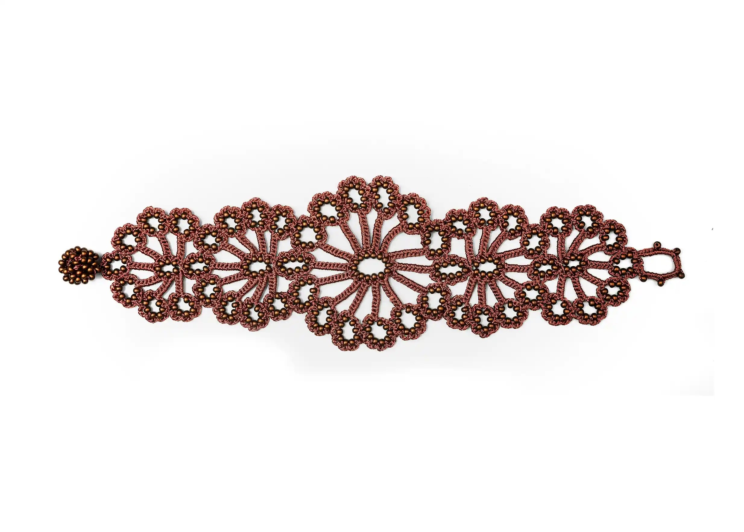 Hawa lace bracelet in matt copper, decorated with pearls, white cut-out background