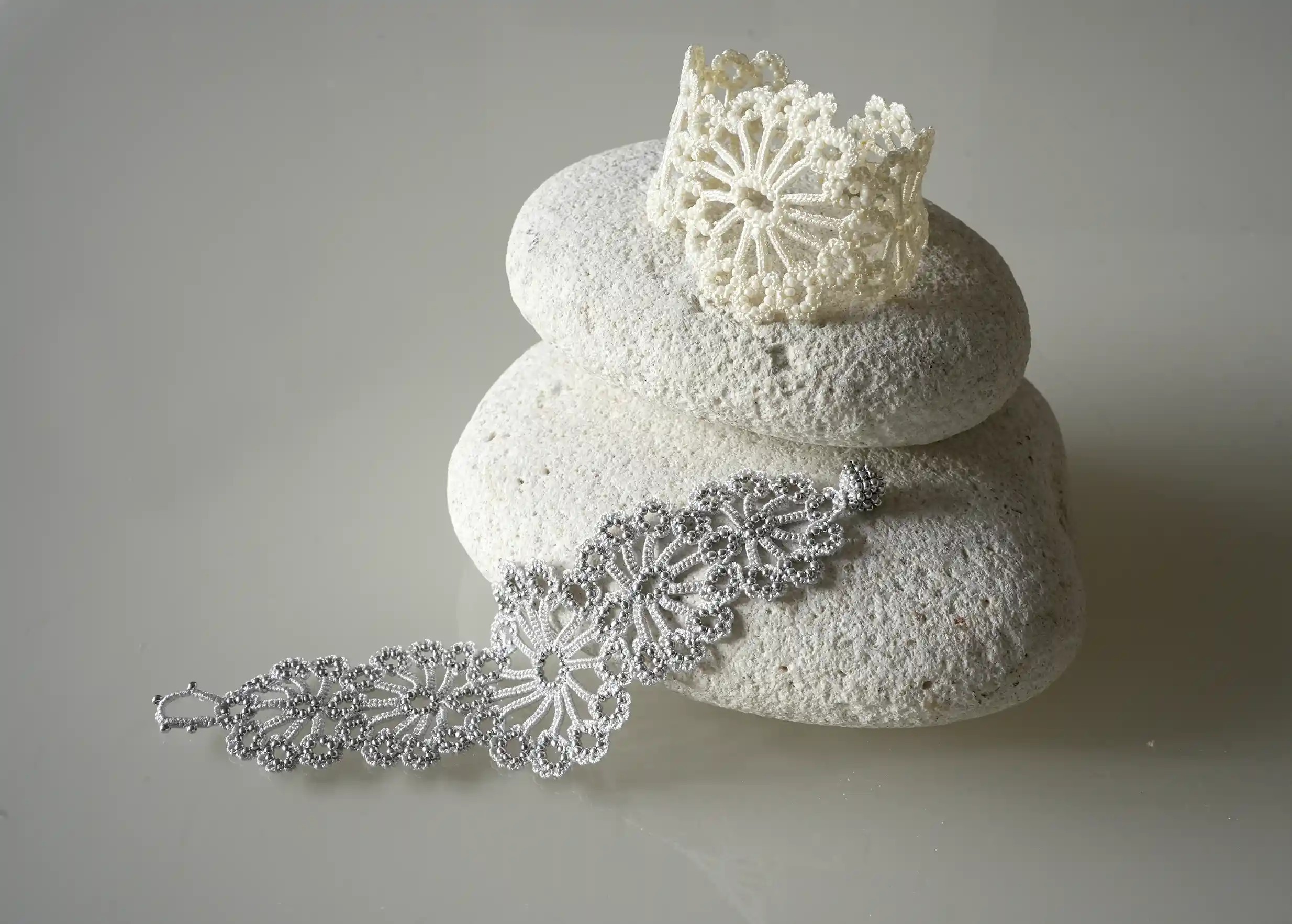 Set of two colours, silver grey and ivory, from the Hawa handmade bracelet collection by Karawan.