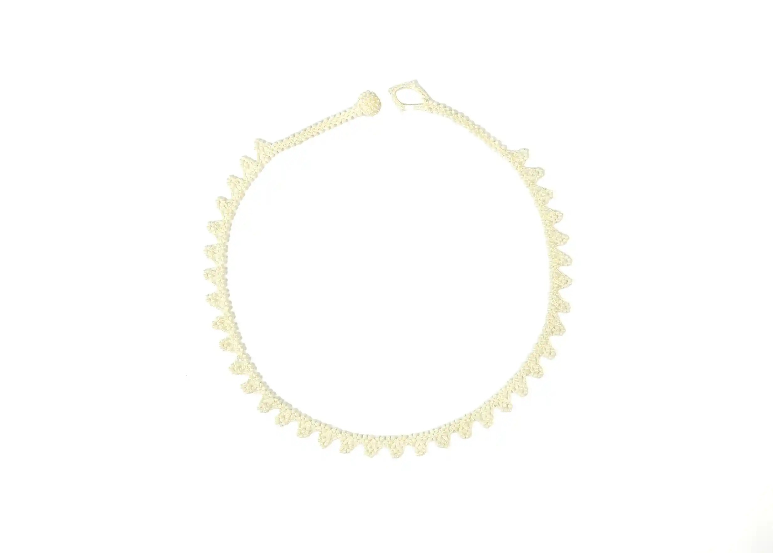 Light ivory lace textile jewellery, Karawan Authentic brand, photo taken against a white background